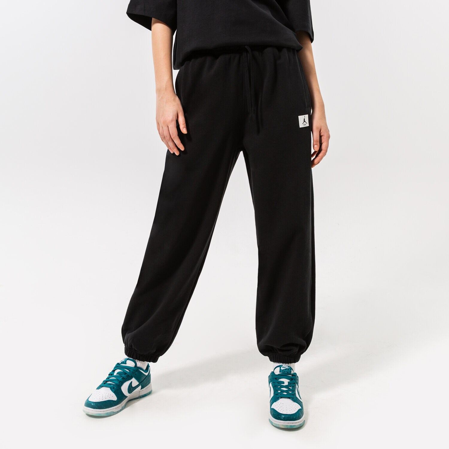 Spodnie sportowe damskie JORDAN SPODNIE W J FLT FLC PANT DQ4607-010 CZARNY