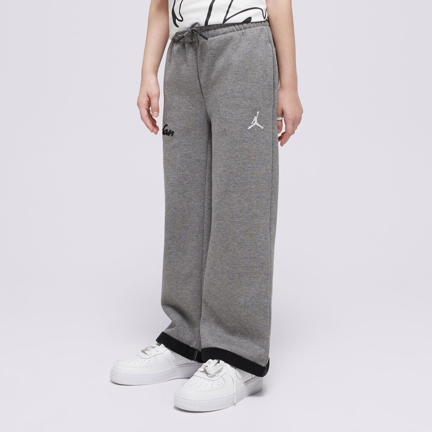 Sportowe spodnie dziecięce JORDAN SPODNIE JDG META-ENCHANTMENT COZY FLC GIRL 45D520-GEH SZARY