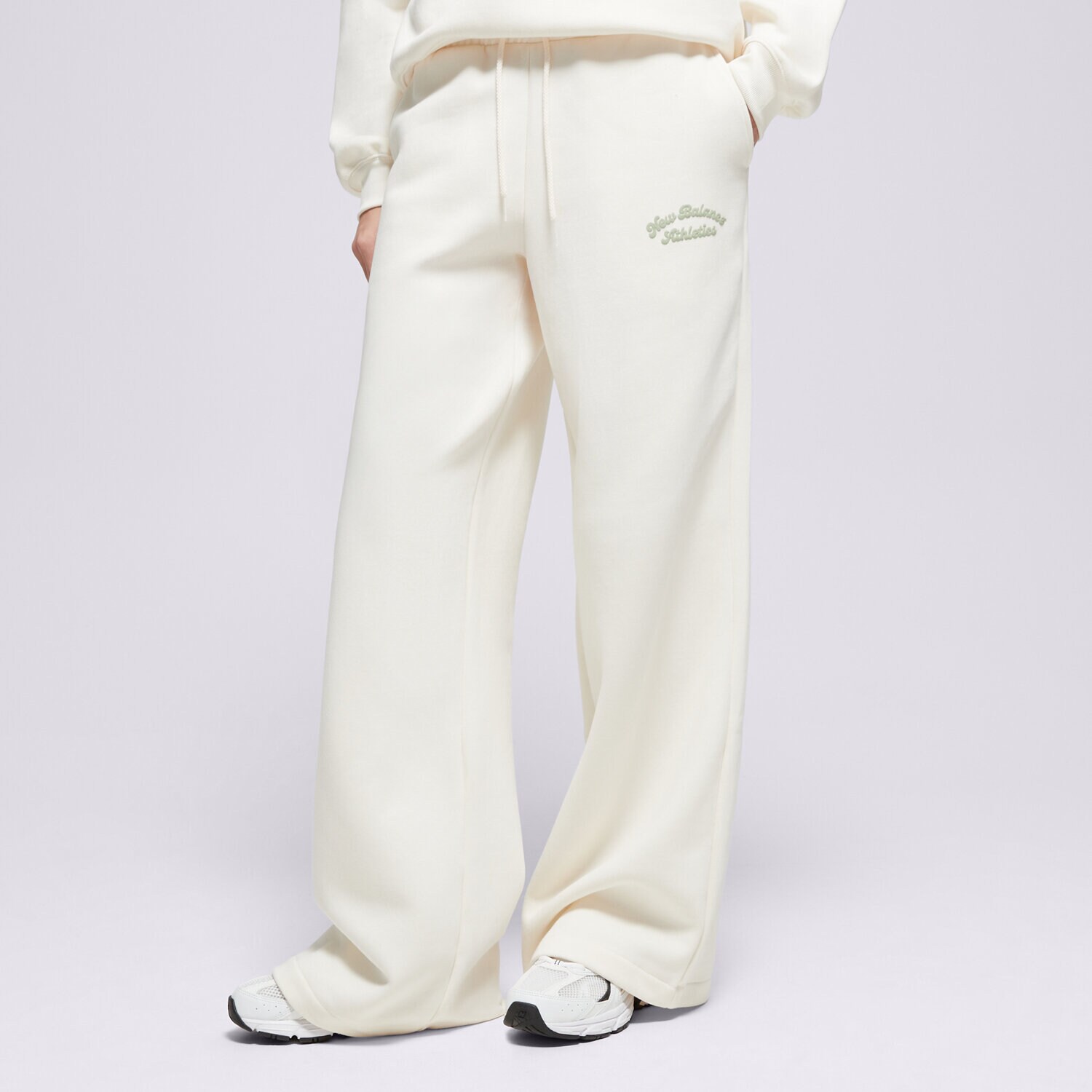 Spodnie sportowe damskie NEW BALANCE SPODNIE LINEAR HERITAGE FLEECE WIDE LEG PANT WP53902PEF BEŻOWY