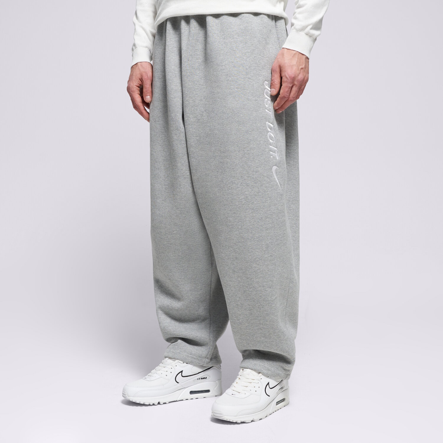 Spodnie sportowe męskie NIKE SPODNIE M NK CLUB BB OS PANT JDI IF1645-063 SZARY
