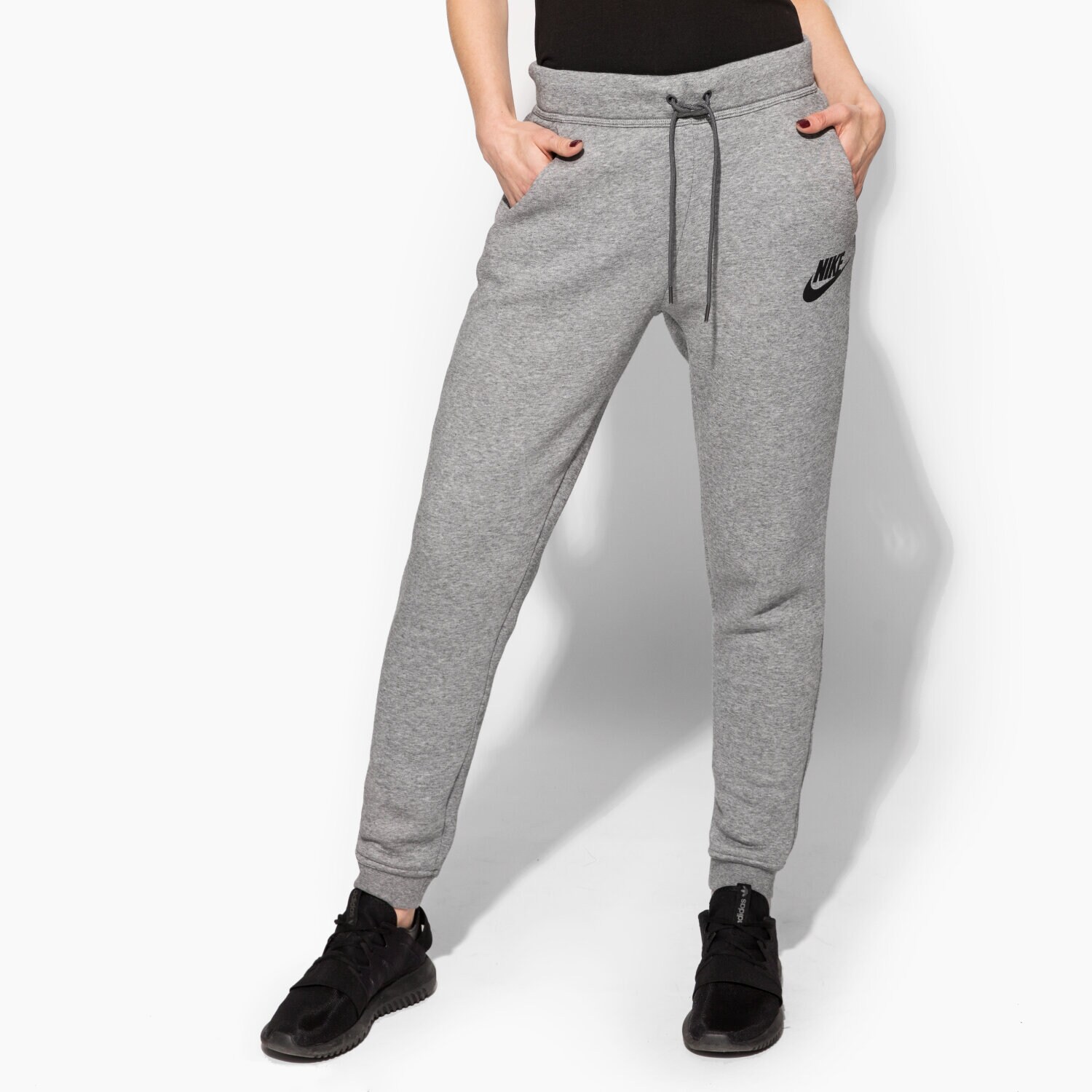 Spodnie sportowe damskie NIKE SPODNIE RALLY PANT REG 828605091 SZARY