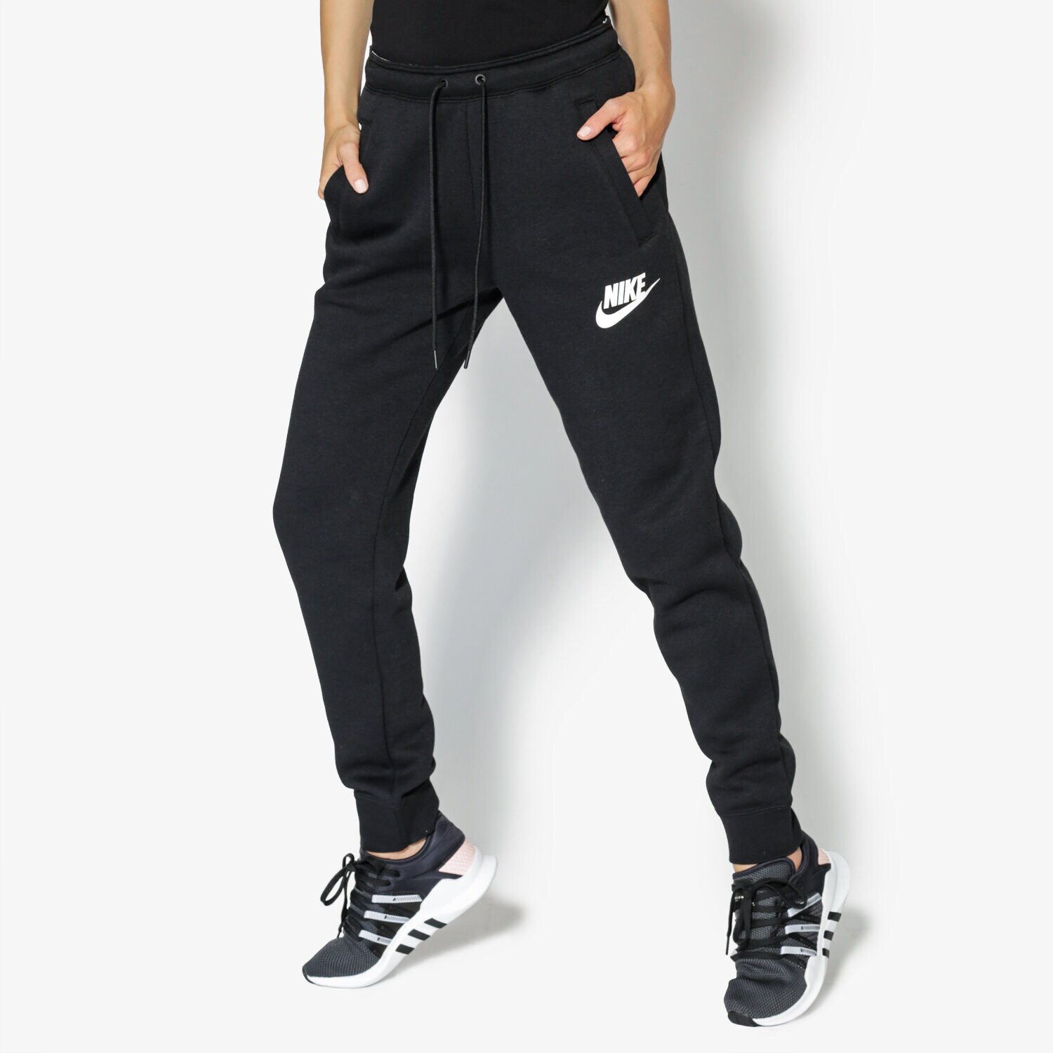 Spodnie sportowe damskie NIKE SPODNIE W NSW RALLY PANT REG 894850-010 CZARNY