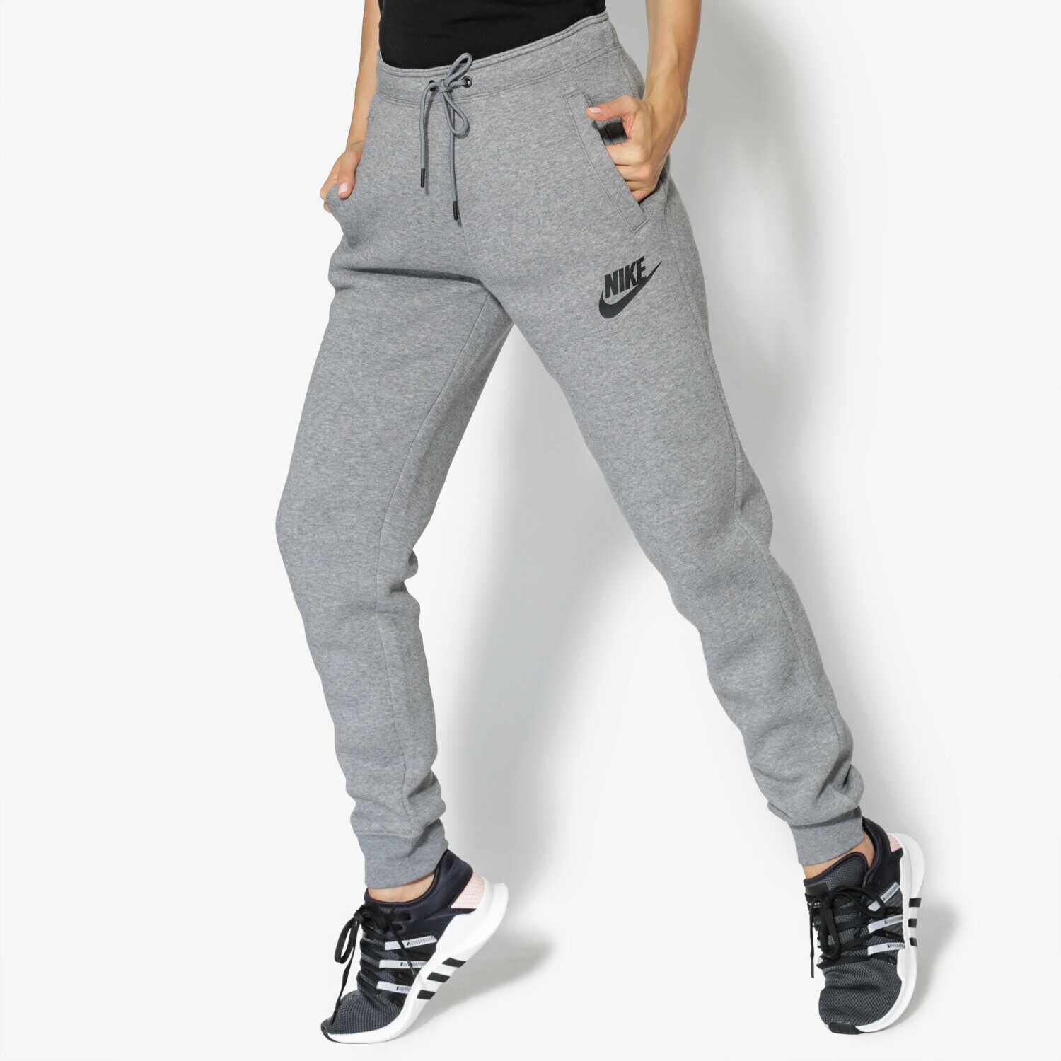 Spodnie sportowe damskie NIKE SPODNIE W NSW RALLY PANT REG 894850-091 SZARY