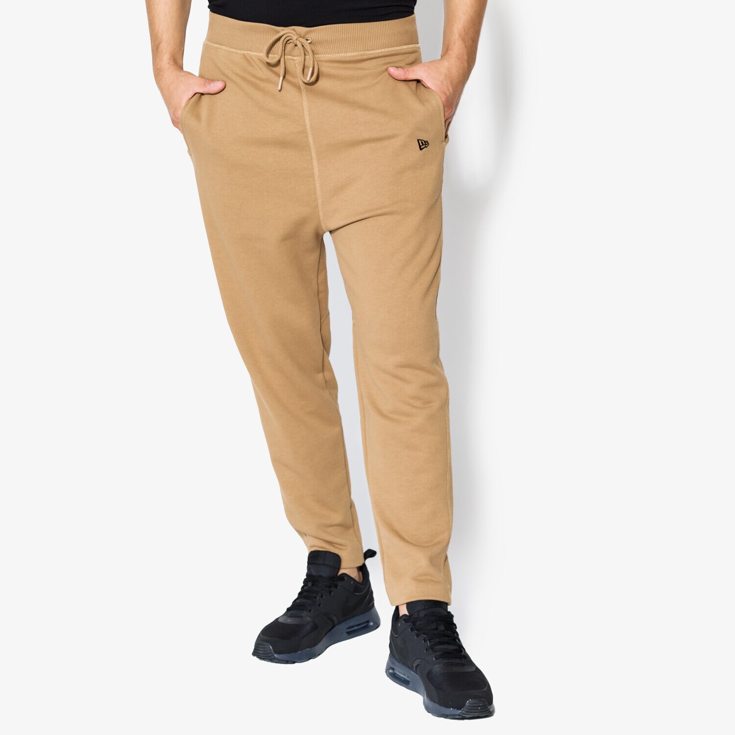 Spodnie sportowe męskie NEW ERA SPODNIE ORIGINATORS TRK PANT NE KHK 11459476 BEŻOWY