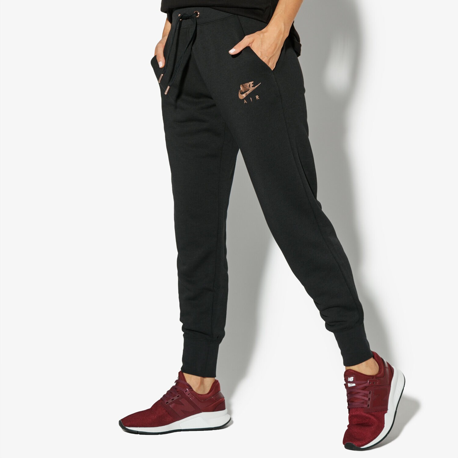 Spodnie sportowe damskie NIKE SPODNIE W NSW RALLY PANT REG AIR 931870-010 CZARNY