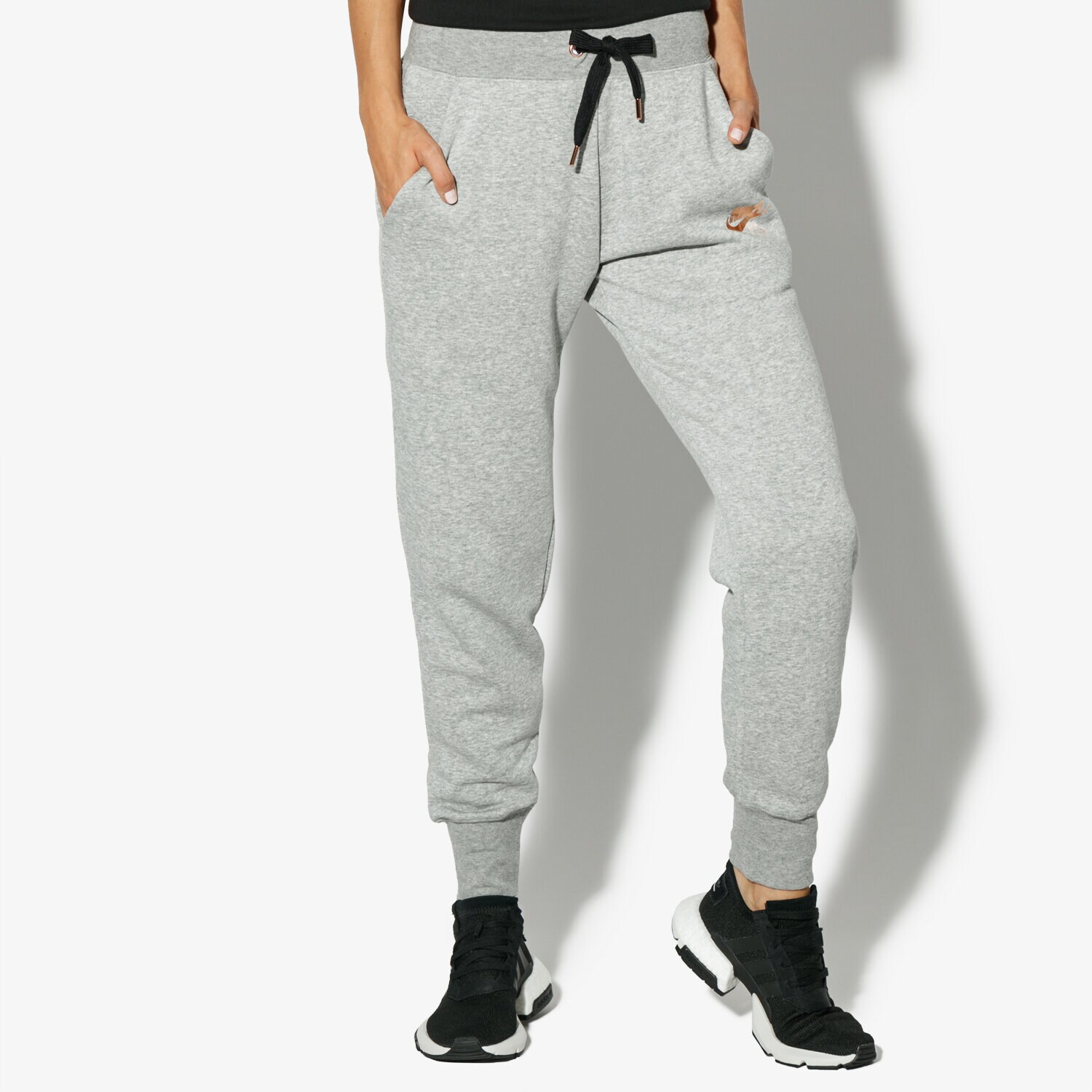 Spodnie sportowe damskie NIKE SPODNIE W NSW RALLY PANT REG AIR 931870-063 SZARY