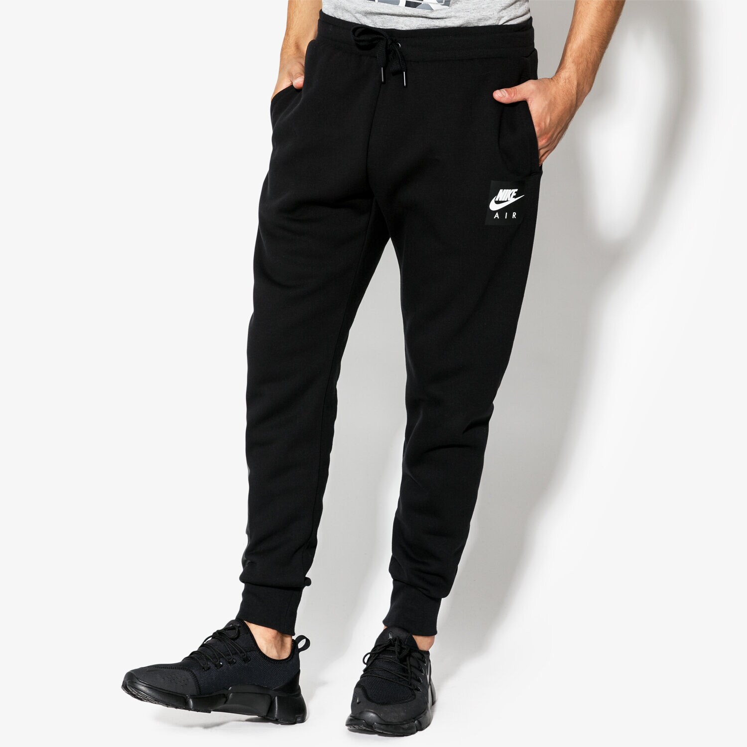 Spodnie sportowe męskie NIKE SPODNIE M NSW PANT FLC NIKE AIR 928637-010 CZARNY