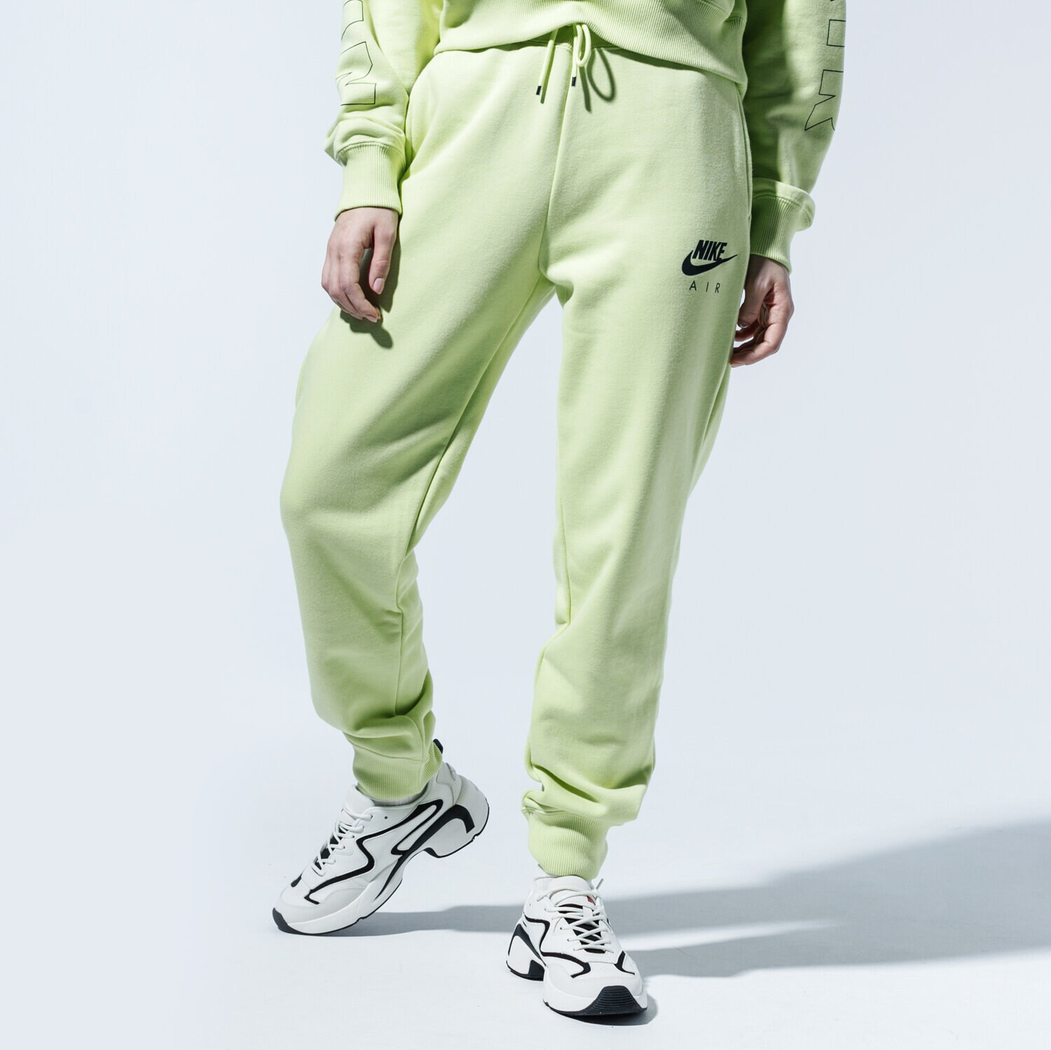 Spodnie sportowe damskie NIKE SPODNIE W NSW AIR PANT FLC BB CJ3047-367 ZIELONY
