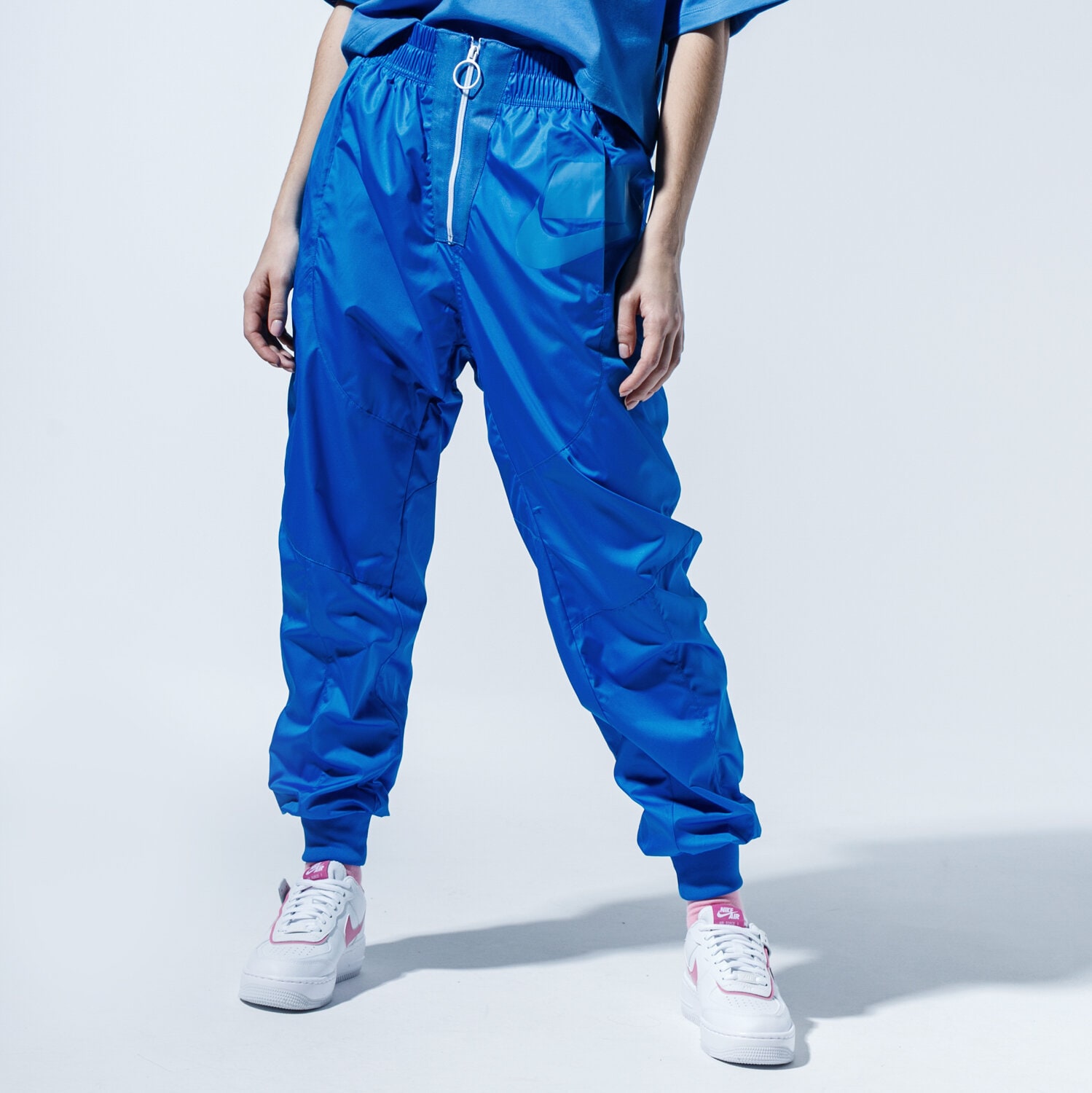 Spodnie sportowe damskie NIKE SPODNIE W NSW NSW PANT WVN CT0880-453 NIEBIESKI