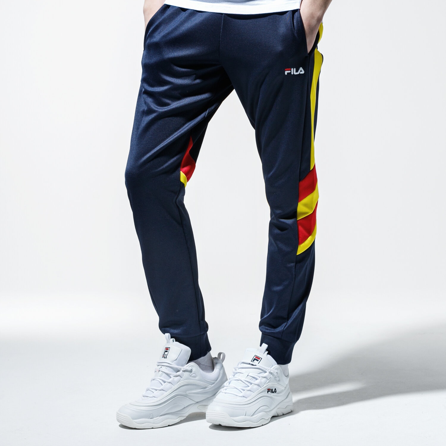 Spodnie sportowe męskie FILA SPODNIE NERITAN TRACK PANTS 687240A465 GRANATOWY