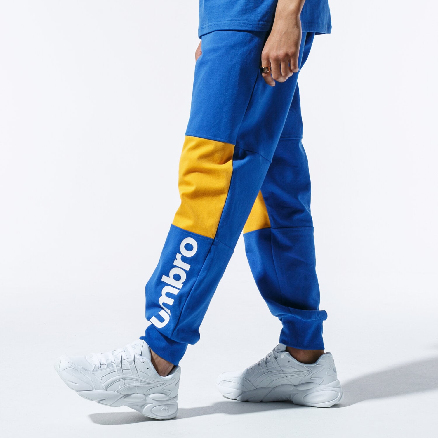 Spodnie sportowe męskie UMBRO SPODNIE RETRO PANTS BLU UL39SPM81001 NIEBIESKI