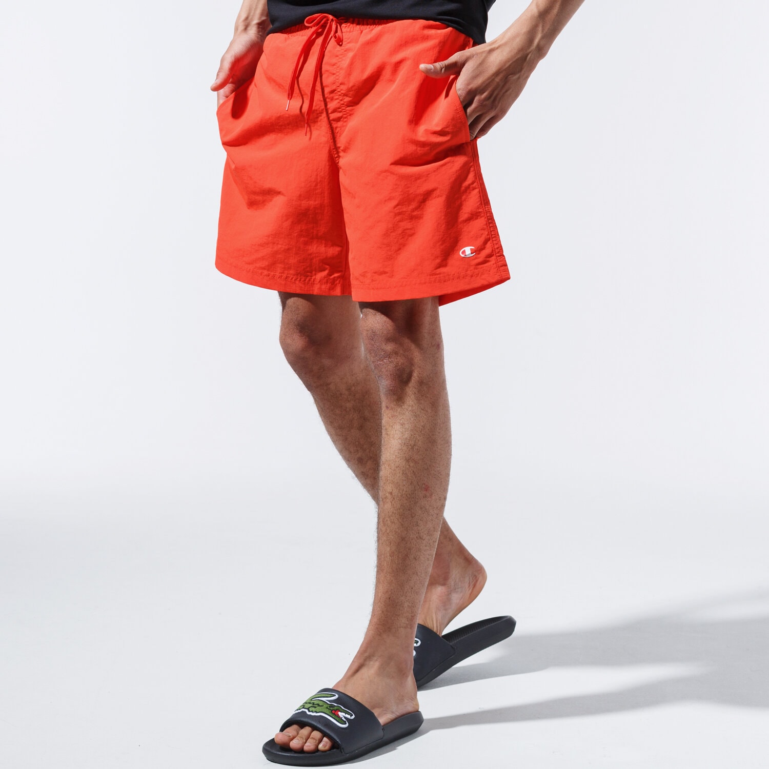Krótkie spodenki, szorty męskie CHAMPION SZORTY BASIC SWIM SHORTS 215498YS057 POMARAŃCZOWY