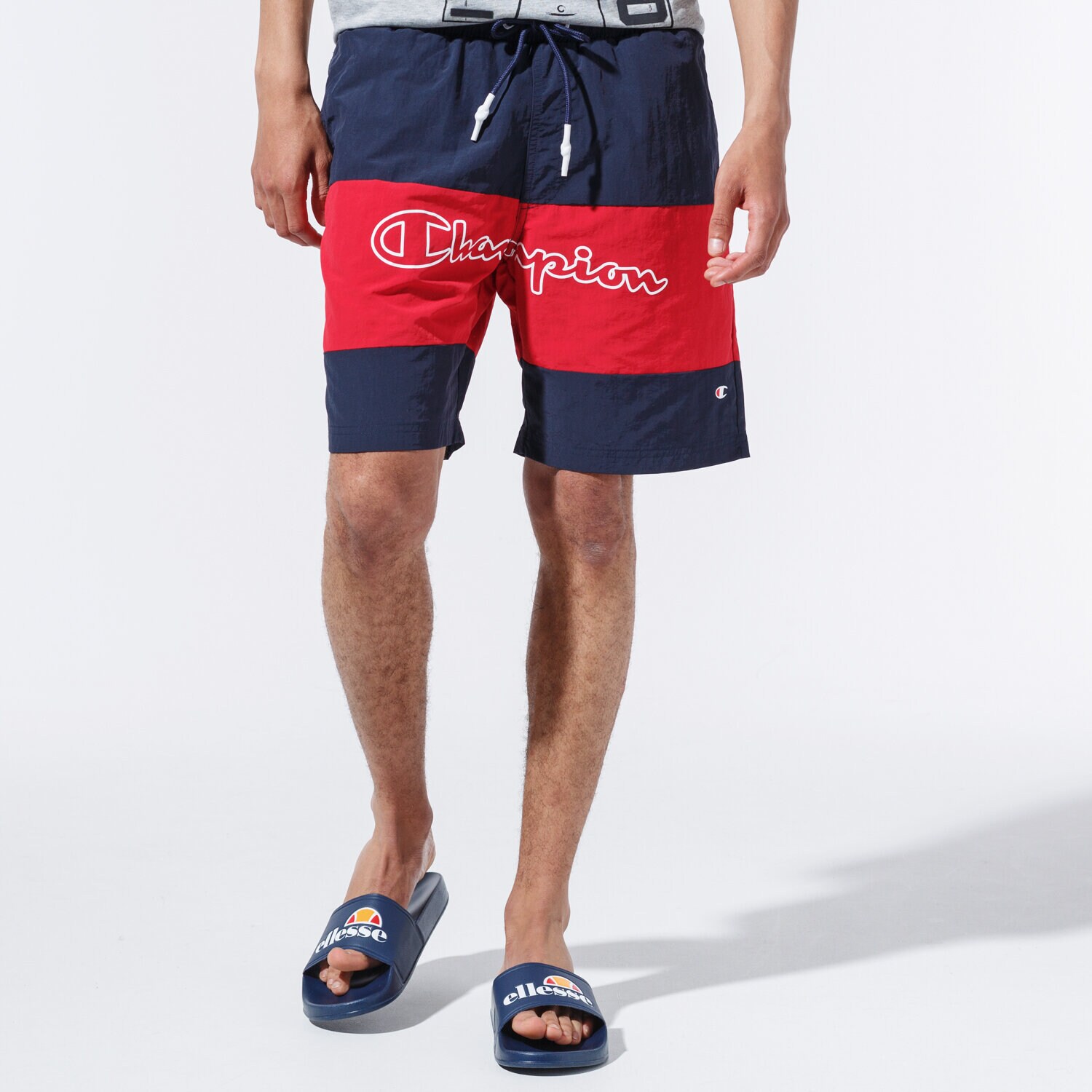 Krótkie spodenki, szorty męskie CHAMPION SZORTY LOGO SWIM SHORTS 215499BS501 GRANATOWY