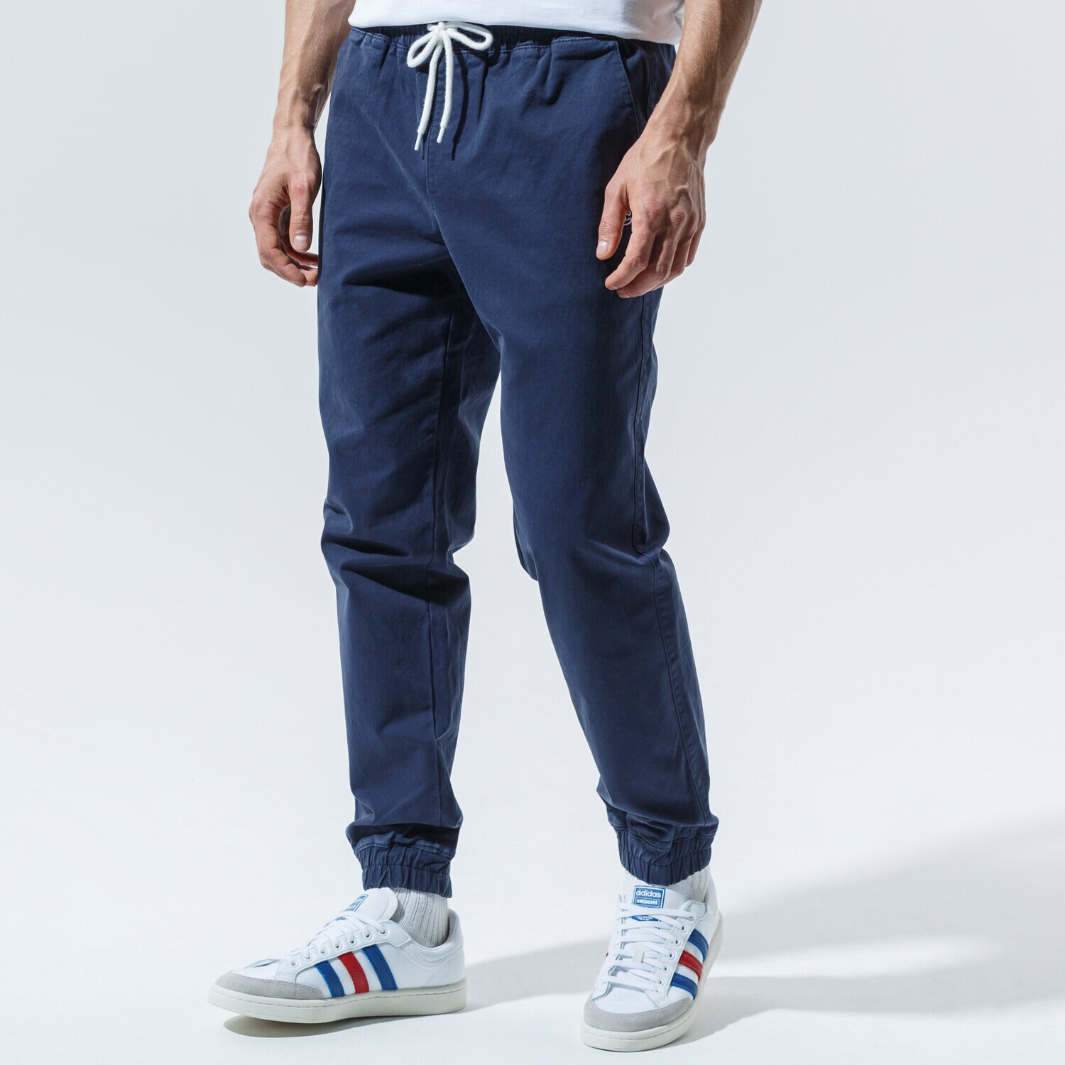 Spodnie sportowe męskie CHAMPION SPODNIE ELASTIC CUFF PANTS 215193BS538 GRANATOWY