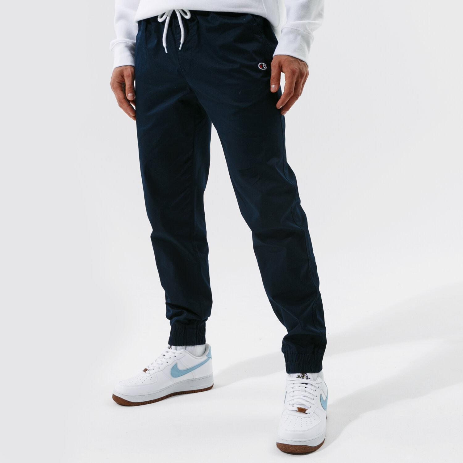 Spodnie sportowe męskie CHAMPION SPODNIE ELASTIC CUFF PANTS 214366BS538 GRANATOWY