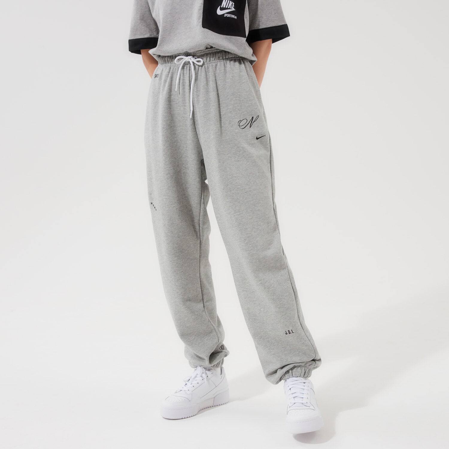 Spodnie sportowe damskie NIKE SPODNIE W NSW ICN CLSH FLC GX HR JGGR DD5042-063 SZARY