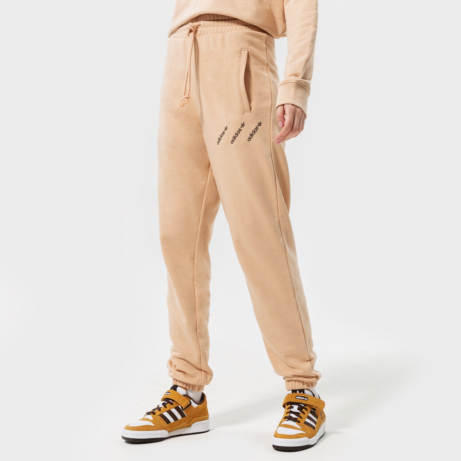 Spodnie sportowe damskie ADIDAS SPODNIE TRACK PANTS HM4871 BEŻOWY