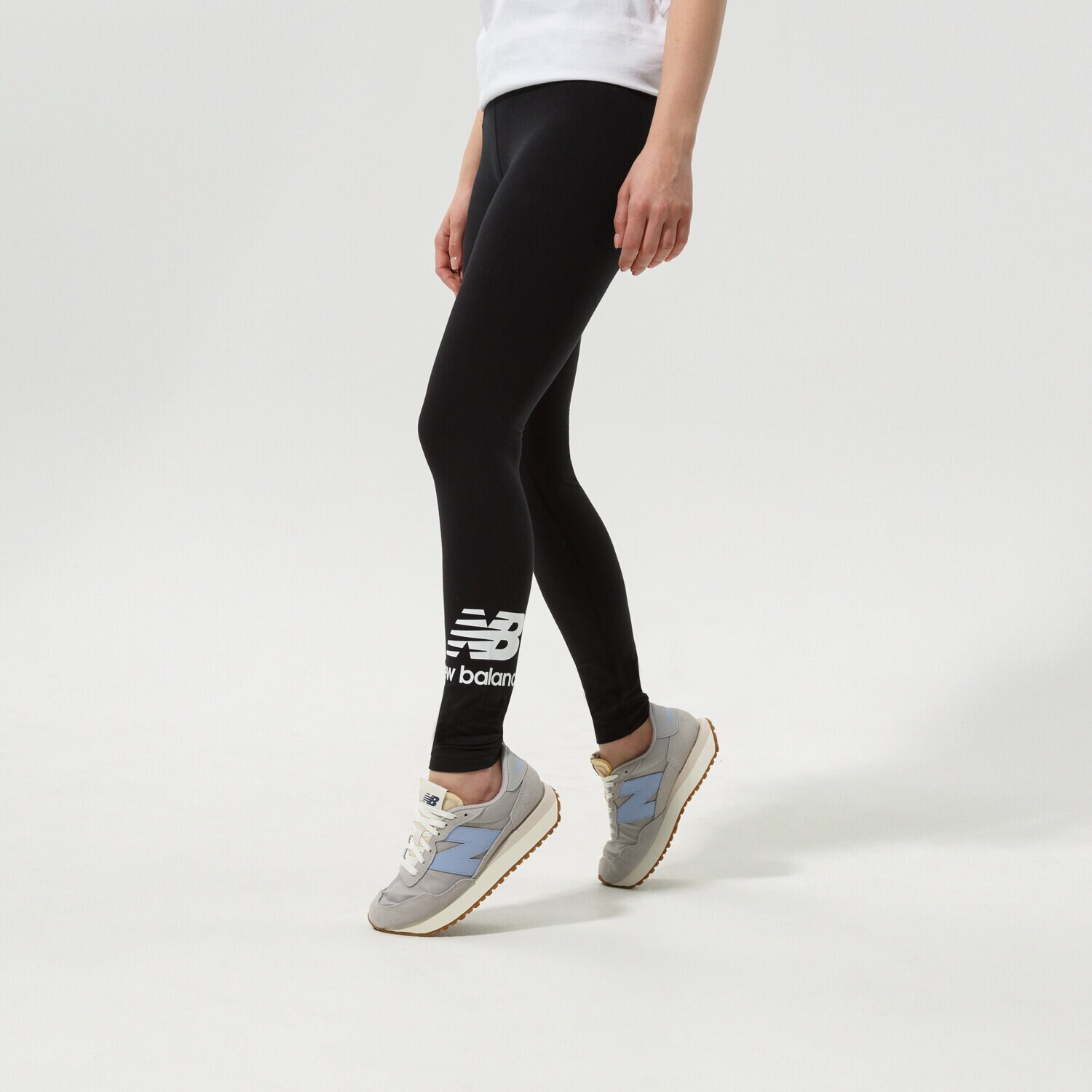Spodnie sportowe damskie NEW BALANCE LEGGINGS NB ESSENTIALS STACKED LEGGING WP21509BK CZARNY