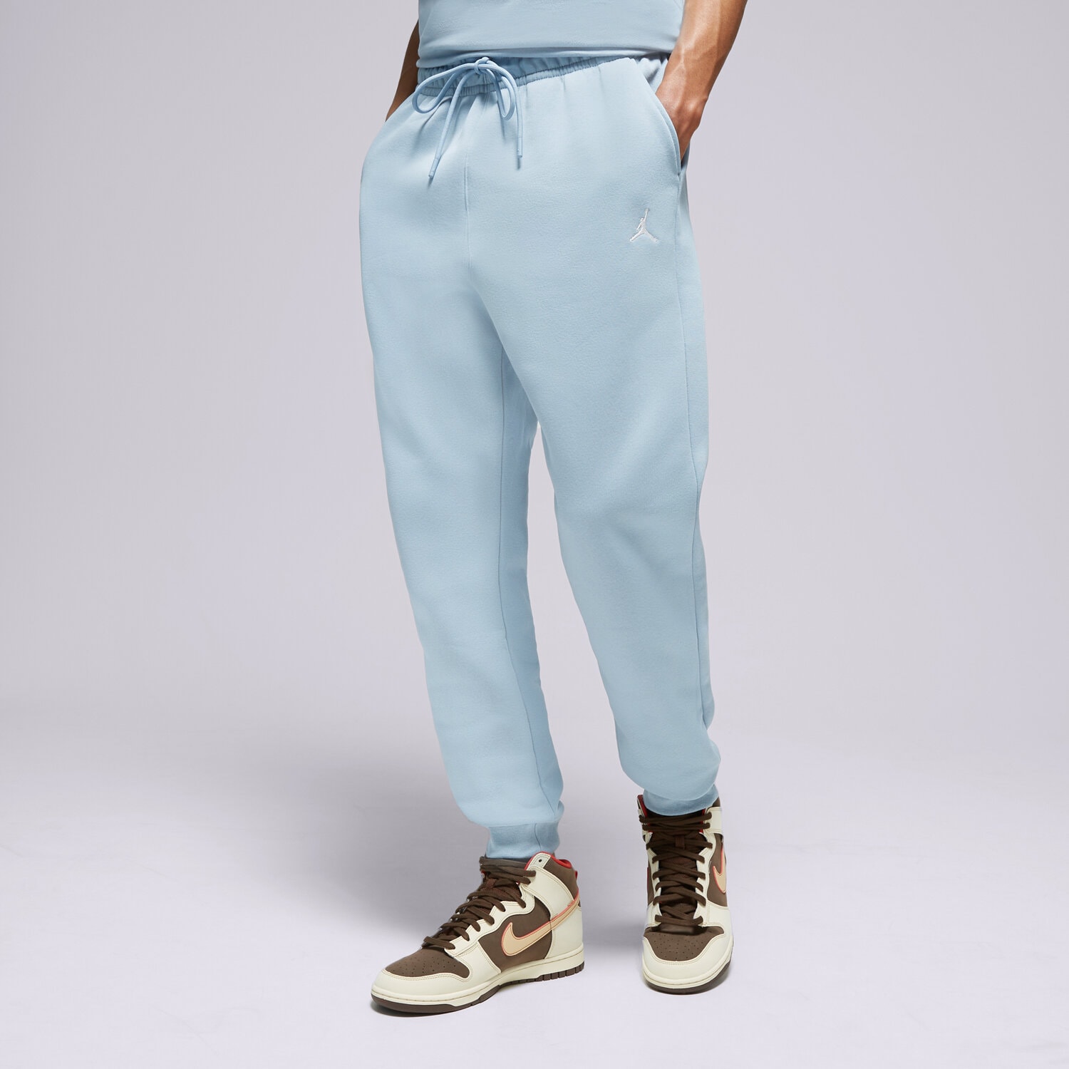 Spodnie sportowe męskie JORDAN SPODNIE M J ESS FLC PANT FJ7779-436 NIEBIESKI
