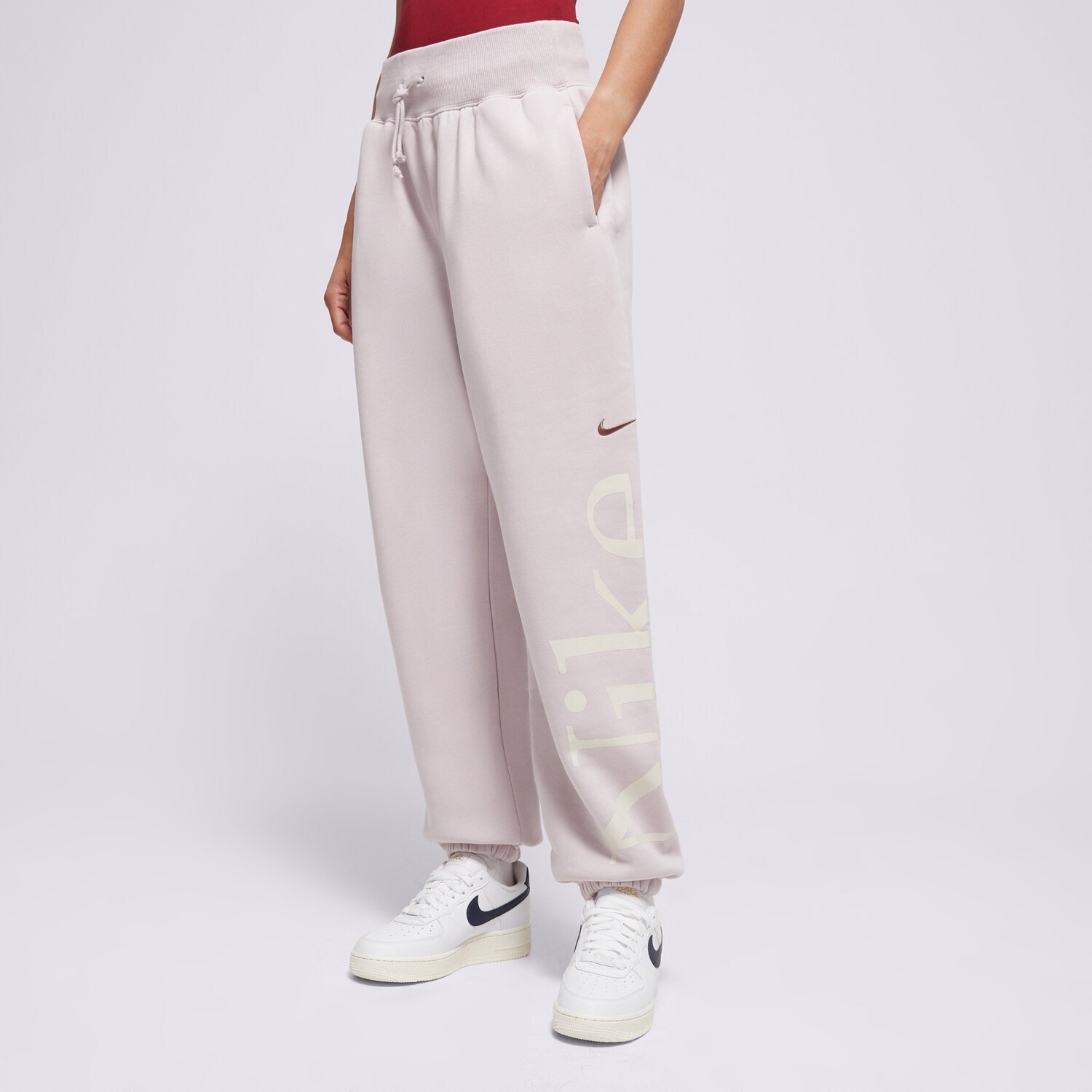 Spodnie sportowe damskie NIKE SPODNIE W NSW PHNX FLC OS LOGO SWTPNT FN2552-019 FIOLETOWY