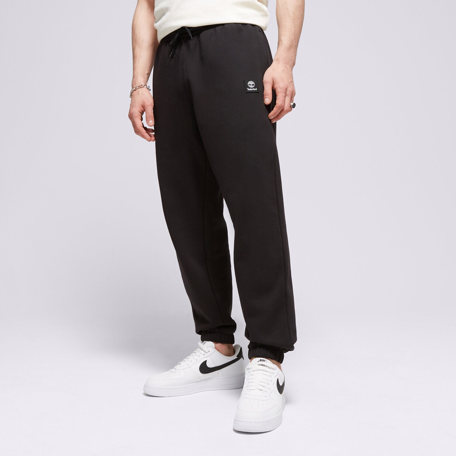 Spodnie sportowe męskie TIMBERLAND SPODNIE NEW WOVEN BADGE SWEATPANT TB0A5UVY0011 CZARNY