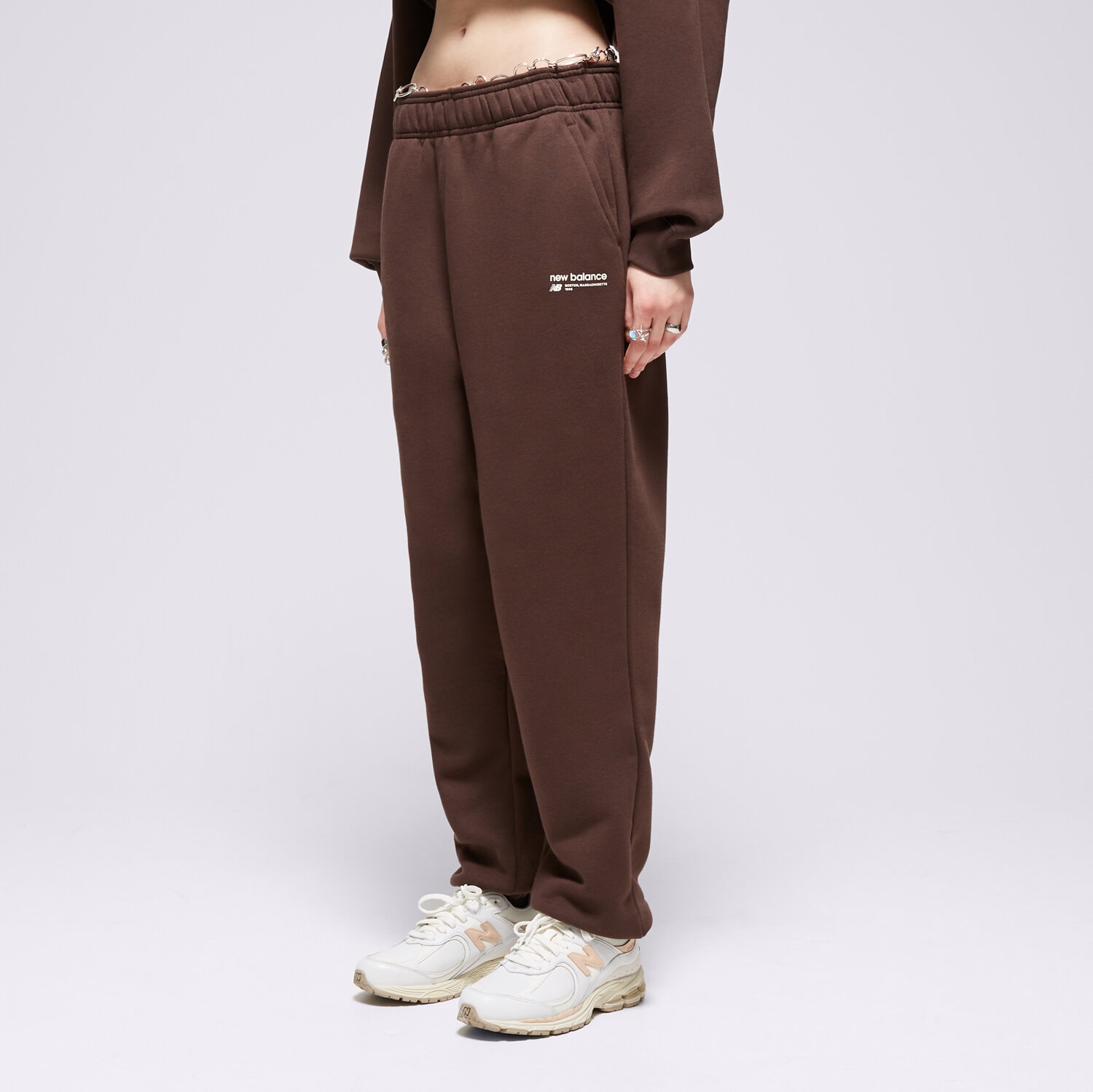 Spodnie sportowe damskie NEW BALANCE SPODNIE LINEAR HERITAGE BRUSHED BACK WP33513KCF BRĄZOWY