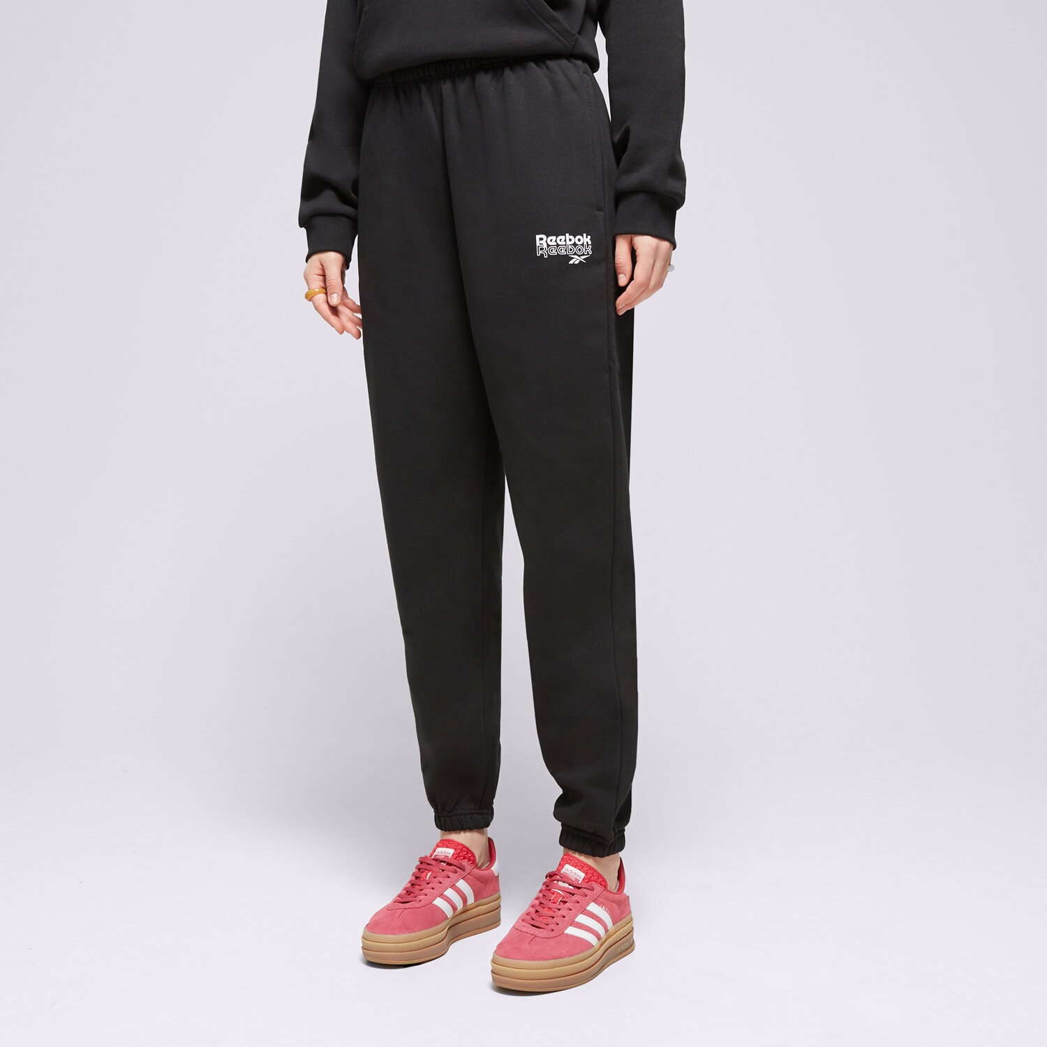 Spodnie sportowe damskie REEBOK SPODNIE RIE 100075980 CZARNY