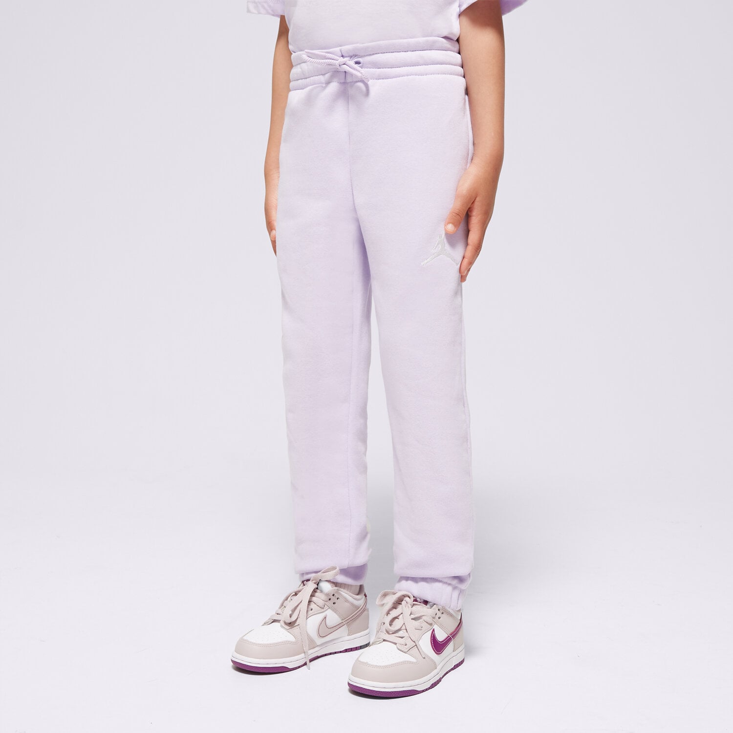 Sportowe spodnie dziecięce JORDAN SPODNIE ICON PLAY FLC PANT GIRL 45C696-P36 FIOLETOWY