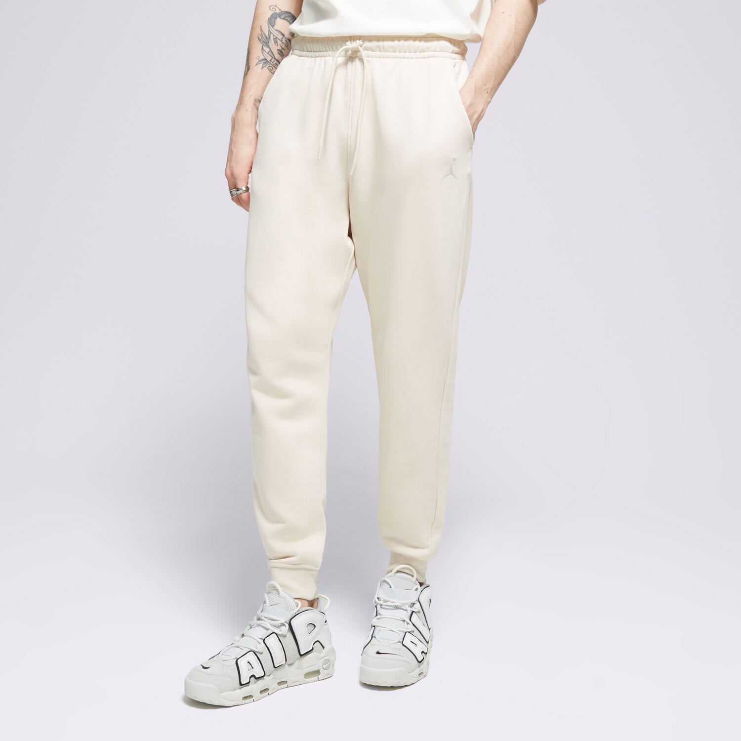 Spodnie sportowe męskie SPODNIE M JORDAN ESS FLC PANT LB FQ7761-203 BEŻOWY