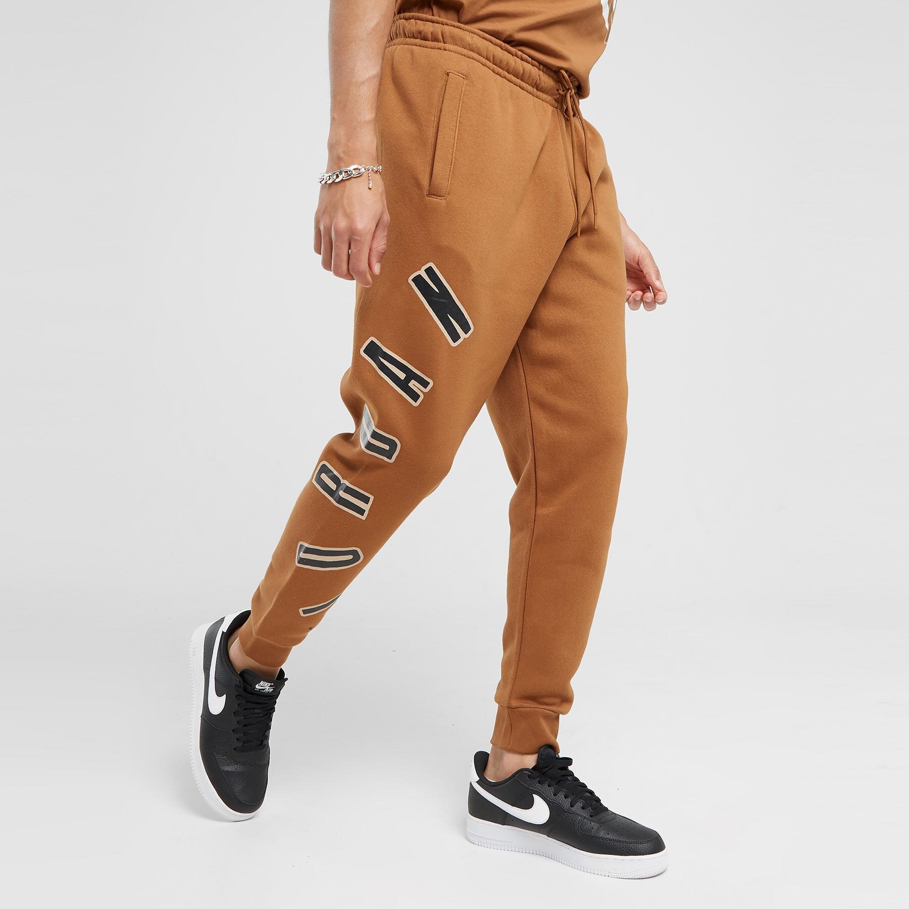 Spodnie sportowe męskie JORDAN SPODNIE M J FLT MVP HBR FLC PANT FB7027-281 BRĄZOWY