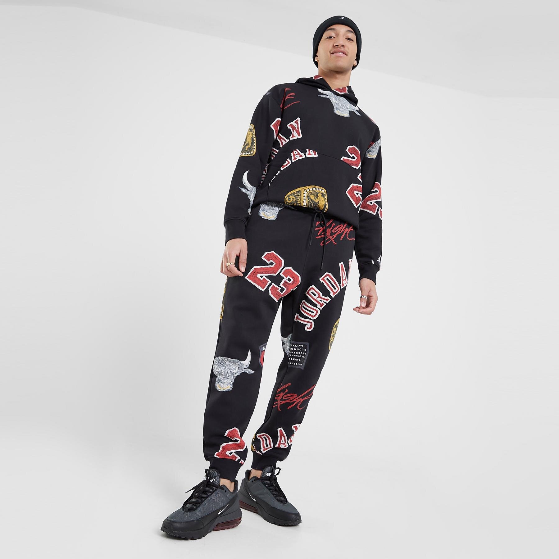Spodnie sportowe męskie JORDAN SPODNIE M J ESS AOP FLC PANT FN4547-010 MULTICOLOR