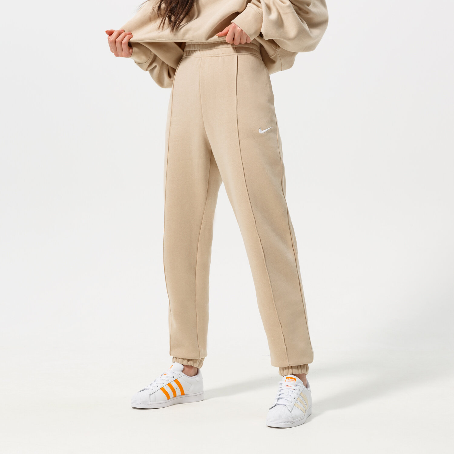 Spodnie sportowe damskie NIKE SPODNIE SPORTSWEAR ESSENTIAL BV4089-126 BEŻOWY