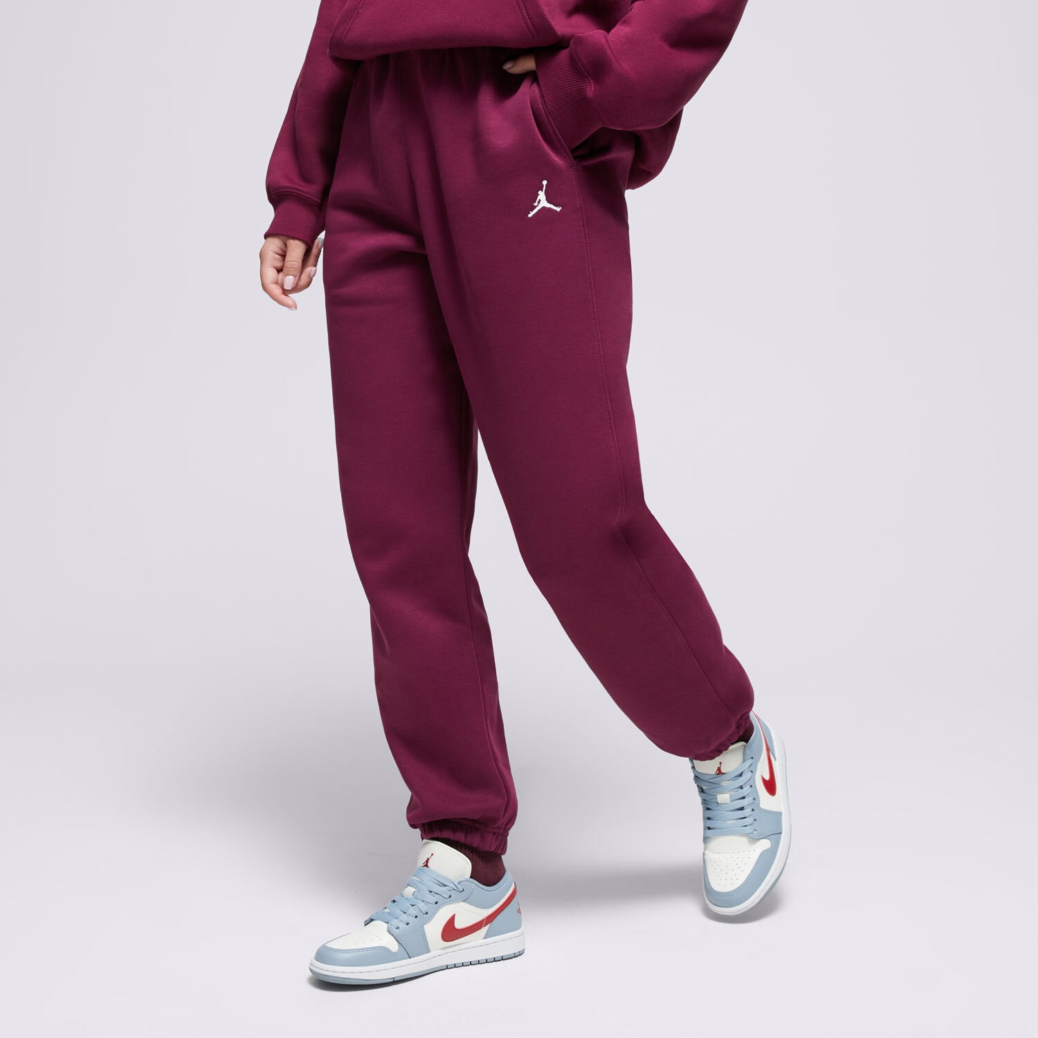 Spodnie sportowe damskie SPODNIE W JORDAN BRKLN FLC PANT 24 FV7077-610 BORDOWY