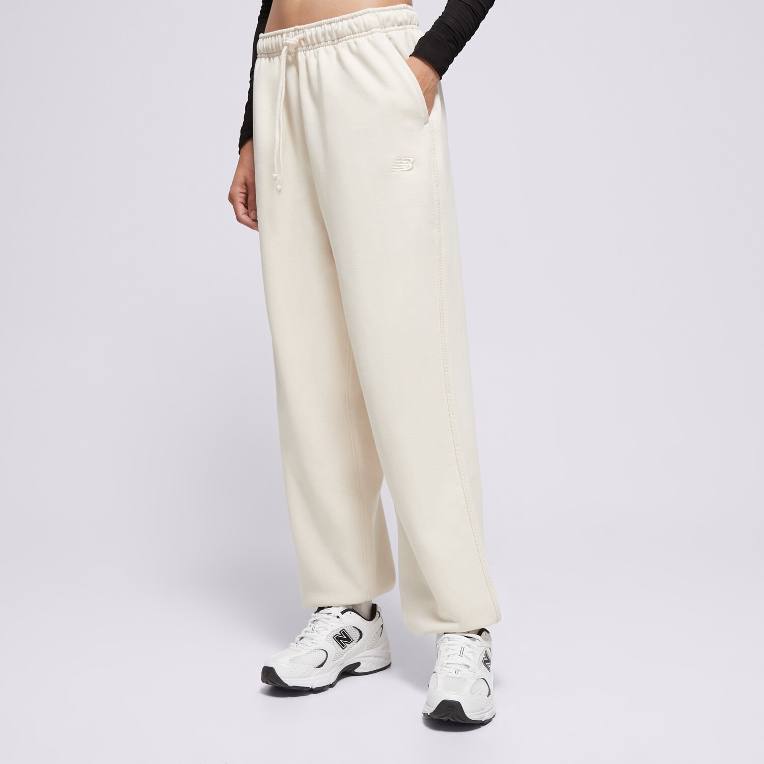 Spodnie sportowe damskie NEW BALANCE SPODNIE ATHLETICS FRENCH TERRY JOGGER WP41513LIN BEŻOWY