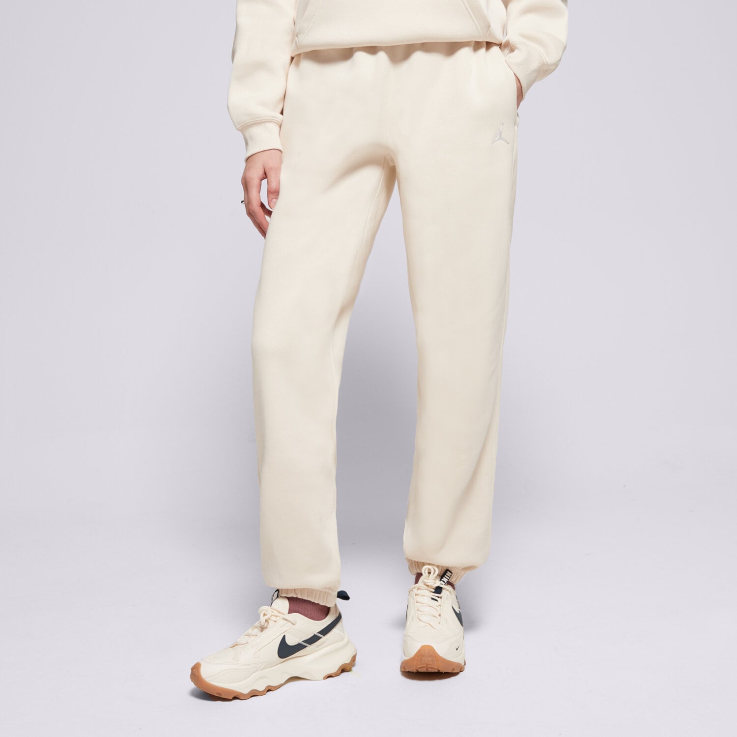 Spodnie sportowe damskie SPODNIE W JORDAN BRKLN FLC PANT 24 FV7077-203 BEŻOWY