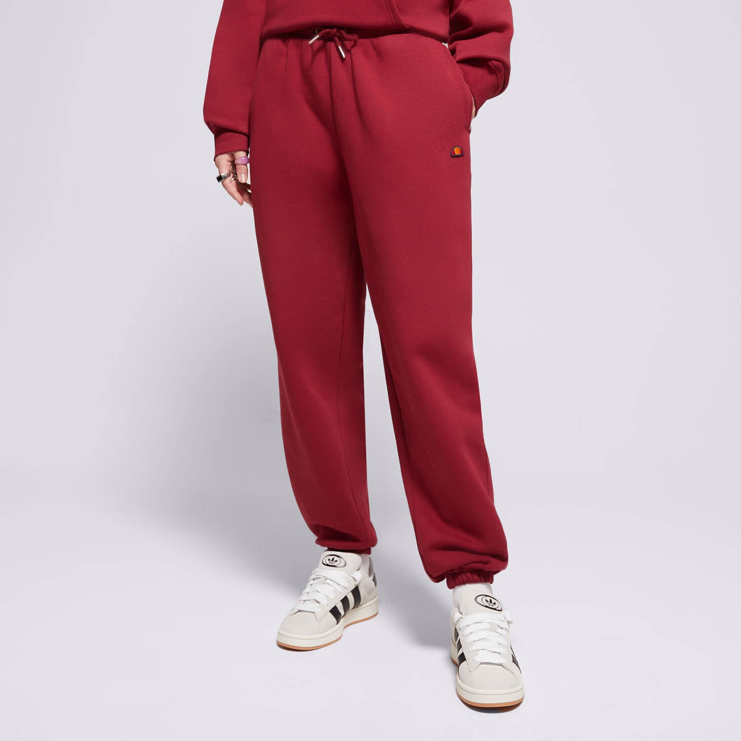 Spodnie sportowe damskie ELLESSE SPODNIE MUGIA JOG PANT BRGND SMG22040800 BORDOWY