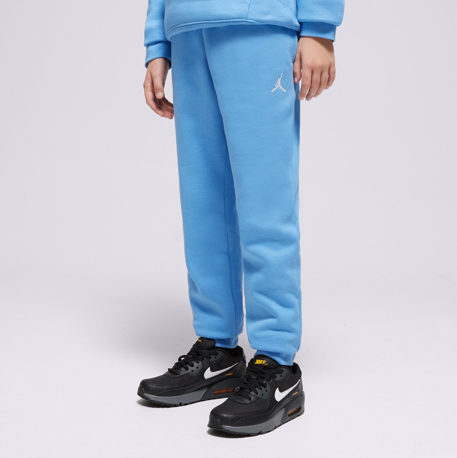 Sportowe spodnie dziecięce JORDAN SPODNIE JDB MJ BROOKLYN FLC ESS PANT BOY 95D234-U25 NIEBIESKI