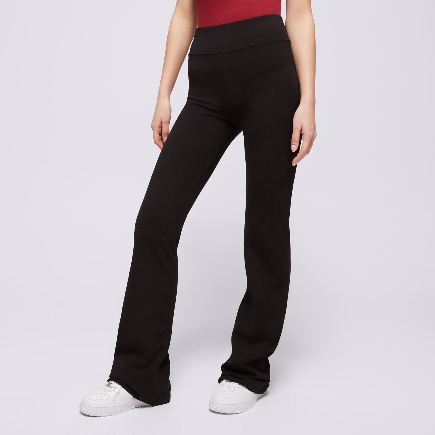 Spodnie sportowe damskie CHAMPION SPODNIE HIGH WAIST FLARE LEGGINS 117559KK001 CZARNY