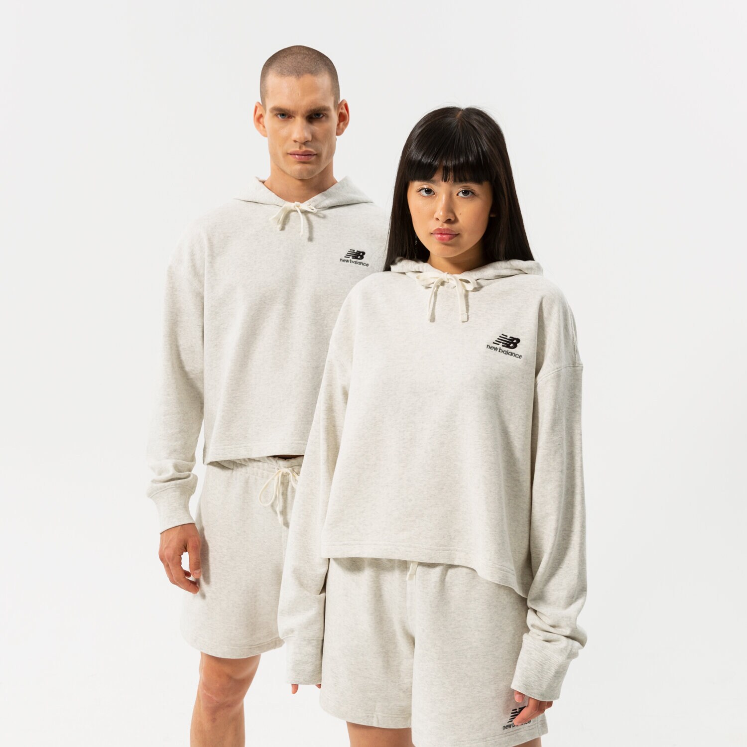 Bluza damska NEW BALANCE BLUZA Z KAPTUREM NB ESSENTIALS UNI-SSENTIALS CRO UT21502SAH SZARY