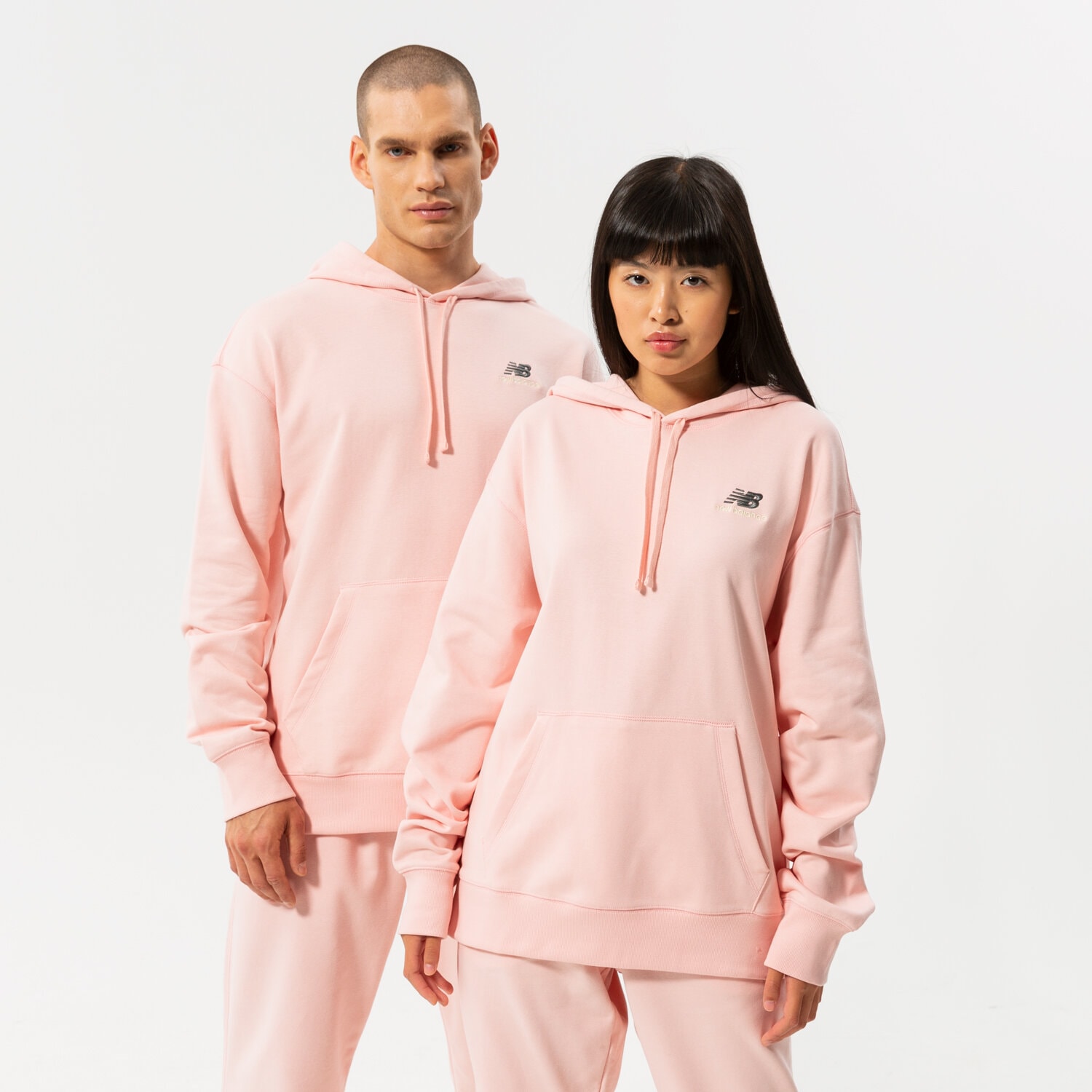 Bluza damska NEW BALANCE BLUZA Z KAPTUREM NB ESSENTIALS UNI-SSENTIALS PO UT21500PIE RÓŻOWY