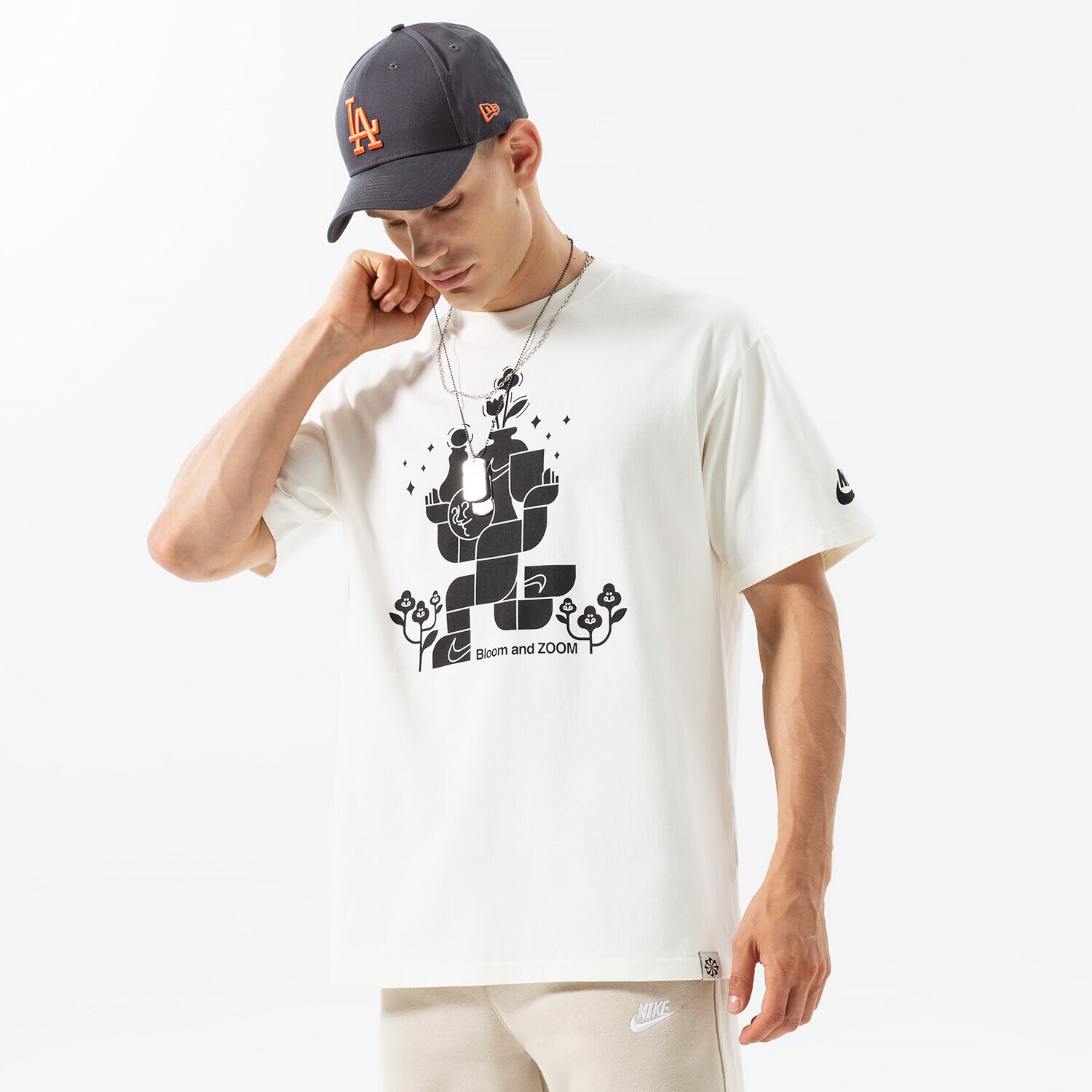 Koszulka, t-shirt sportowy męski NIKE T-SHIRT M NSW SUST M2Z OPEN TEE DQ1010-133 BIAŁY
