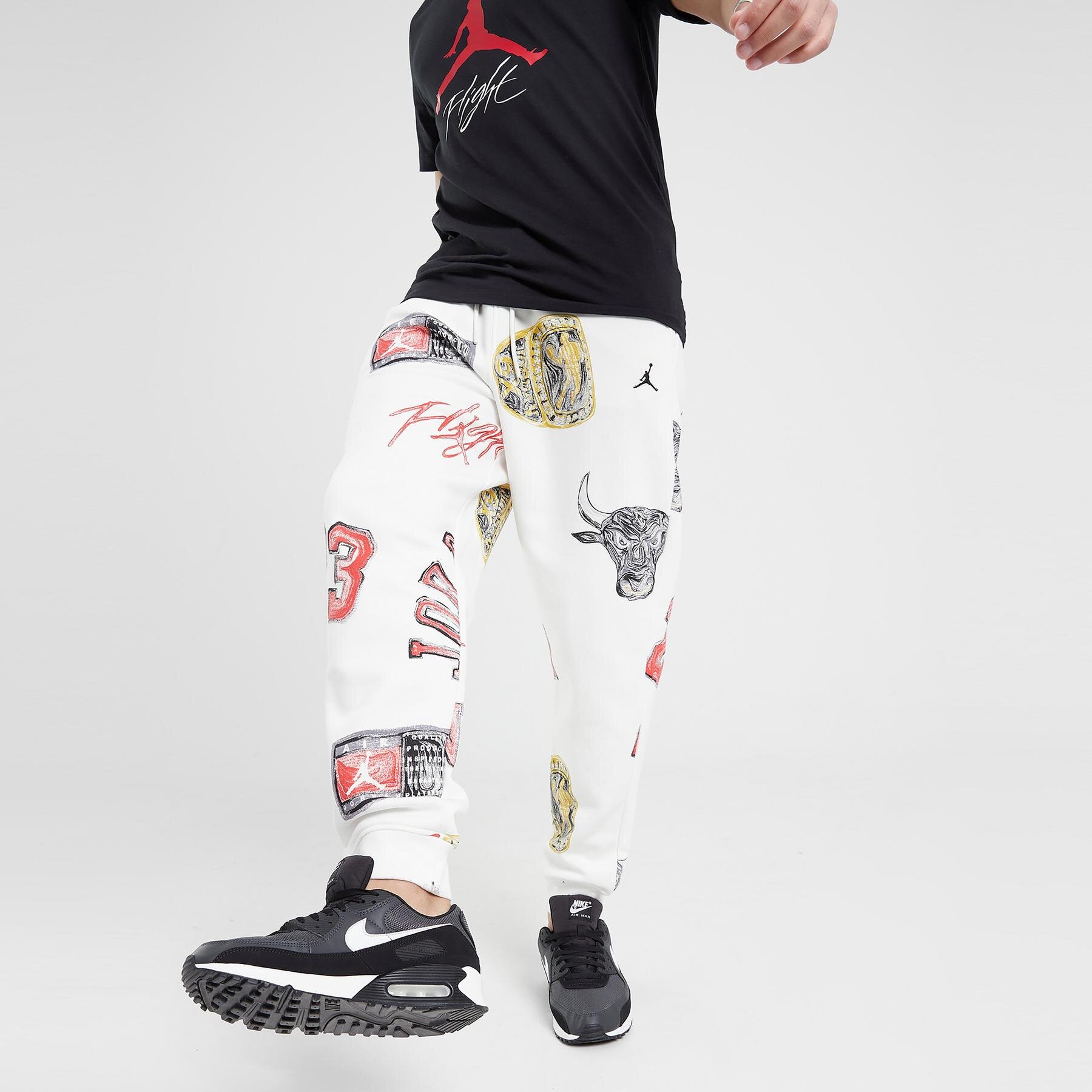 Spodnie sportowe męskie JORDAN SPODNIE M J ESS AOP FLC PANT FN4547-133 MULTICOLOR