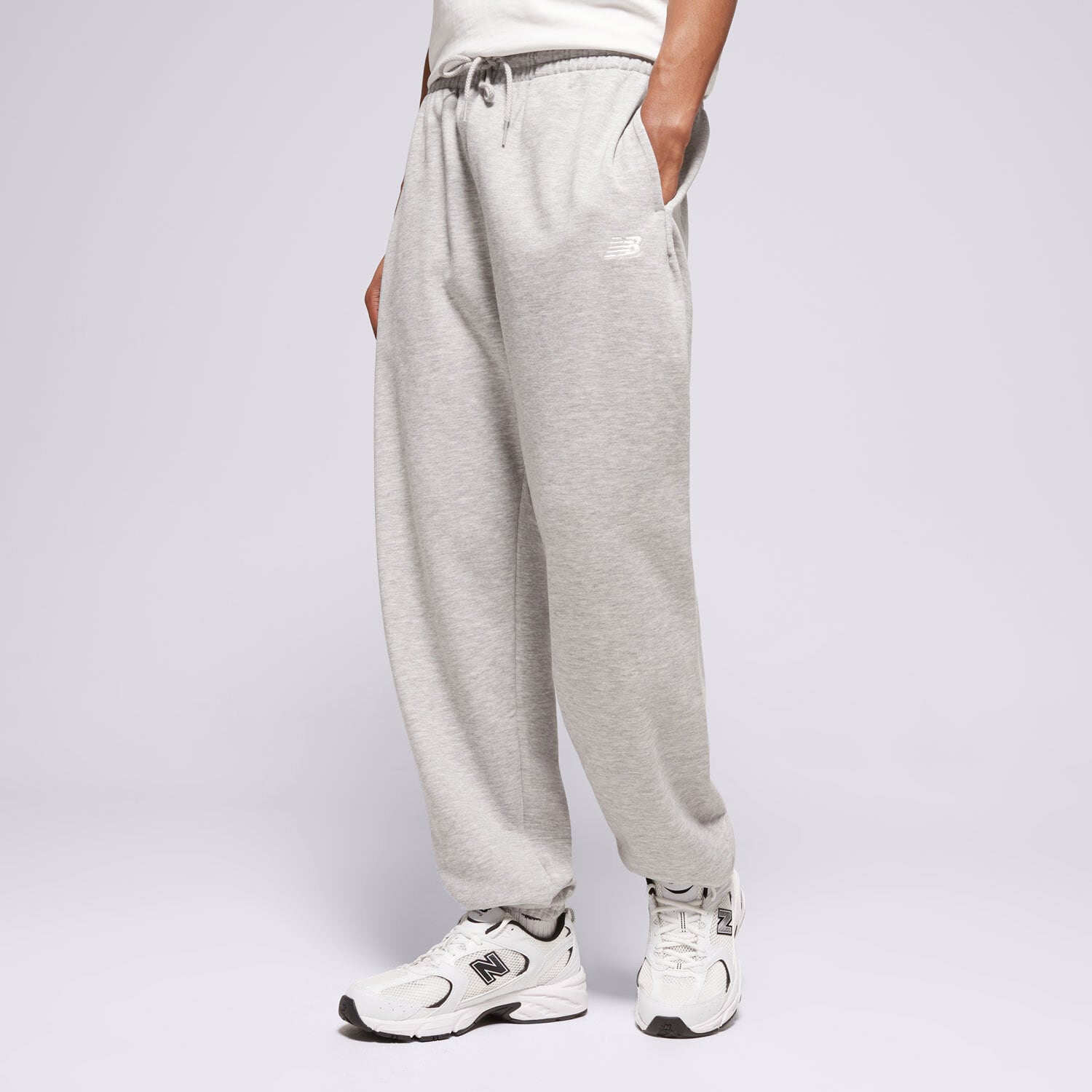 Spodnie sportowe męskie NEW BALANCE SPODNIE SPORT ESSENTIALS FRENCH TERRY JOGGER MP41519AG SZARY