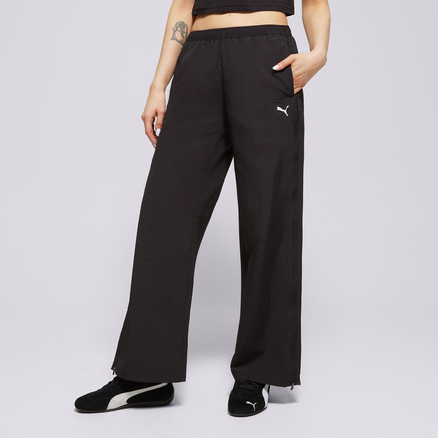Spodnie sportowe damskie PUMA SPODNIE RELAXED WOVEN ZIP-OFF PANTS OP 629808 01 CZARNY