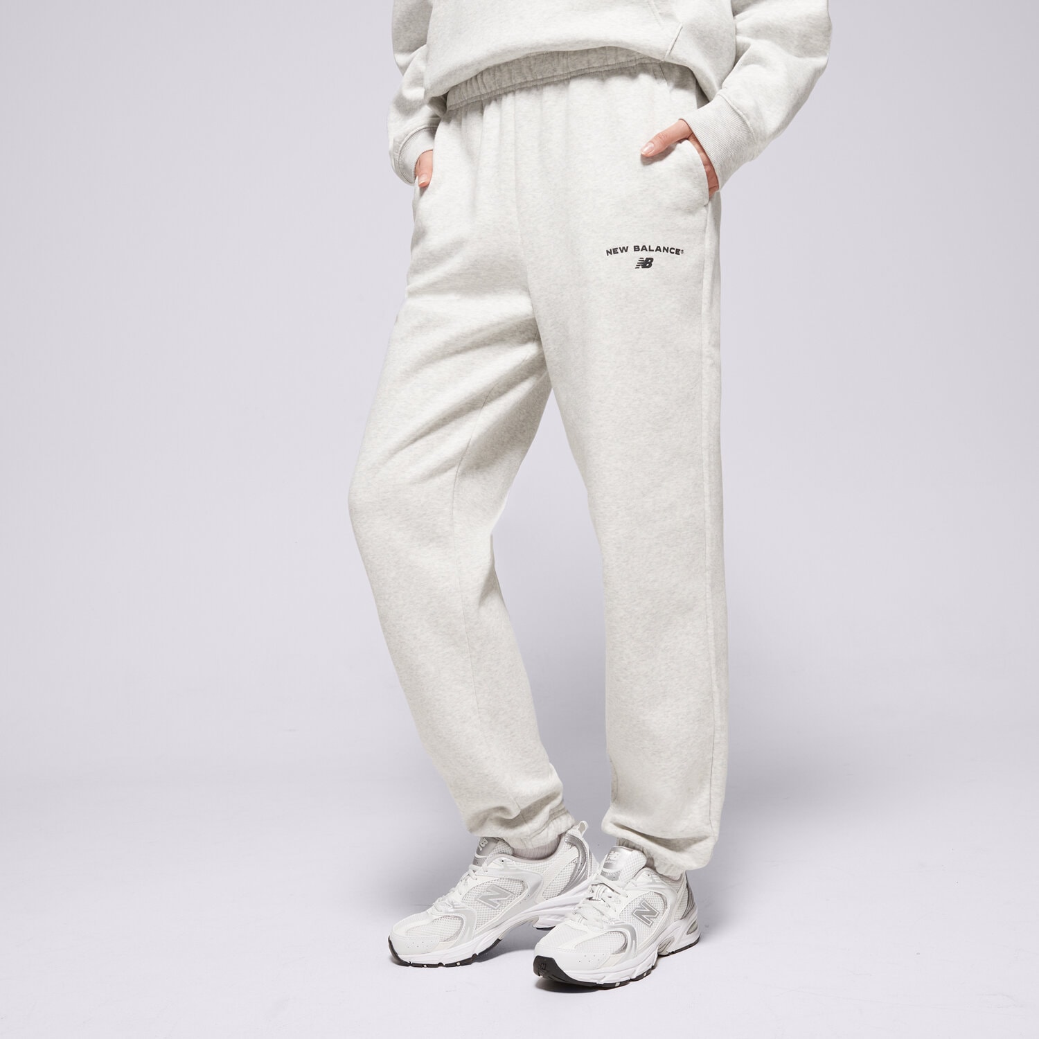 Spodnie sportowe damskie NEW BALANCE SPODNIE REIMAGINED JOGGER WP51500AHH SZARY