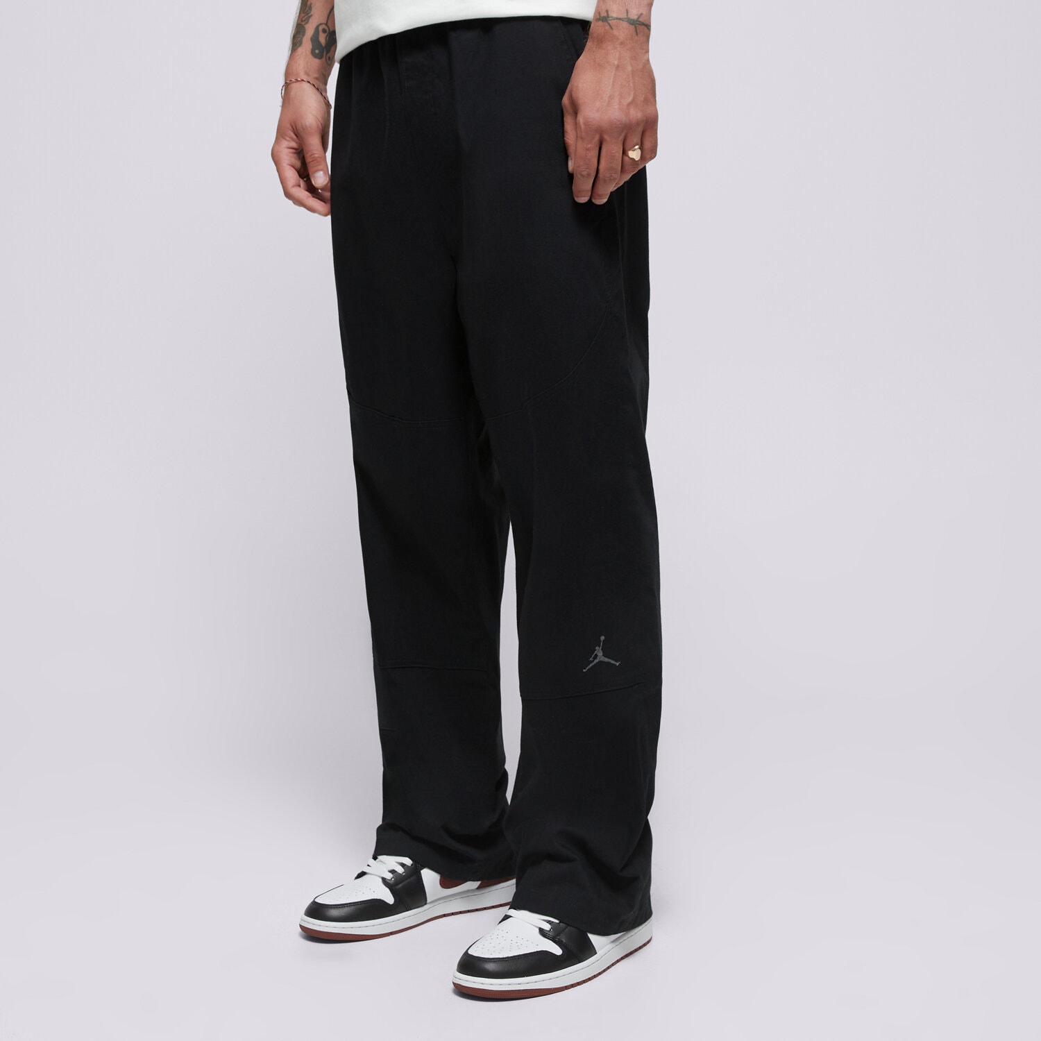 Spodnie sportowe męskie JORDAN SPODNIE M J ESS DBL KNEE WVN PANT HF9329-010 CZARNY