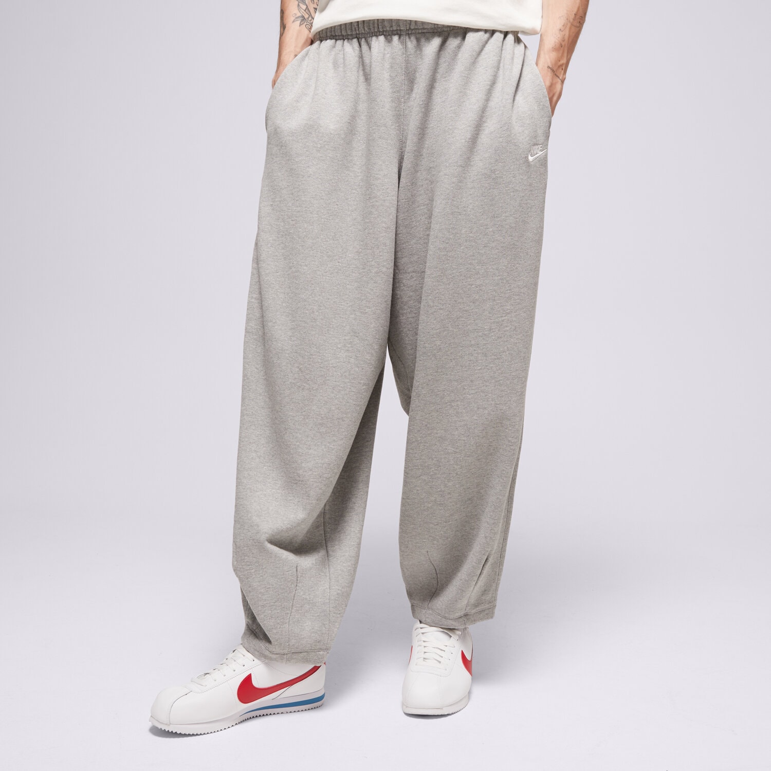 Spodnie sportowe męskie NIKE SPODNIE M NK CLUB FT OVERSIZED PANT HJ1822-063 SZARY