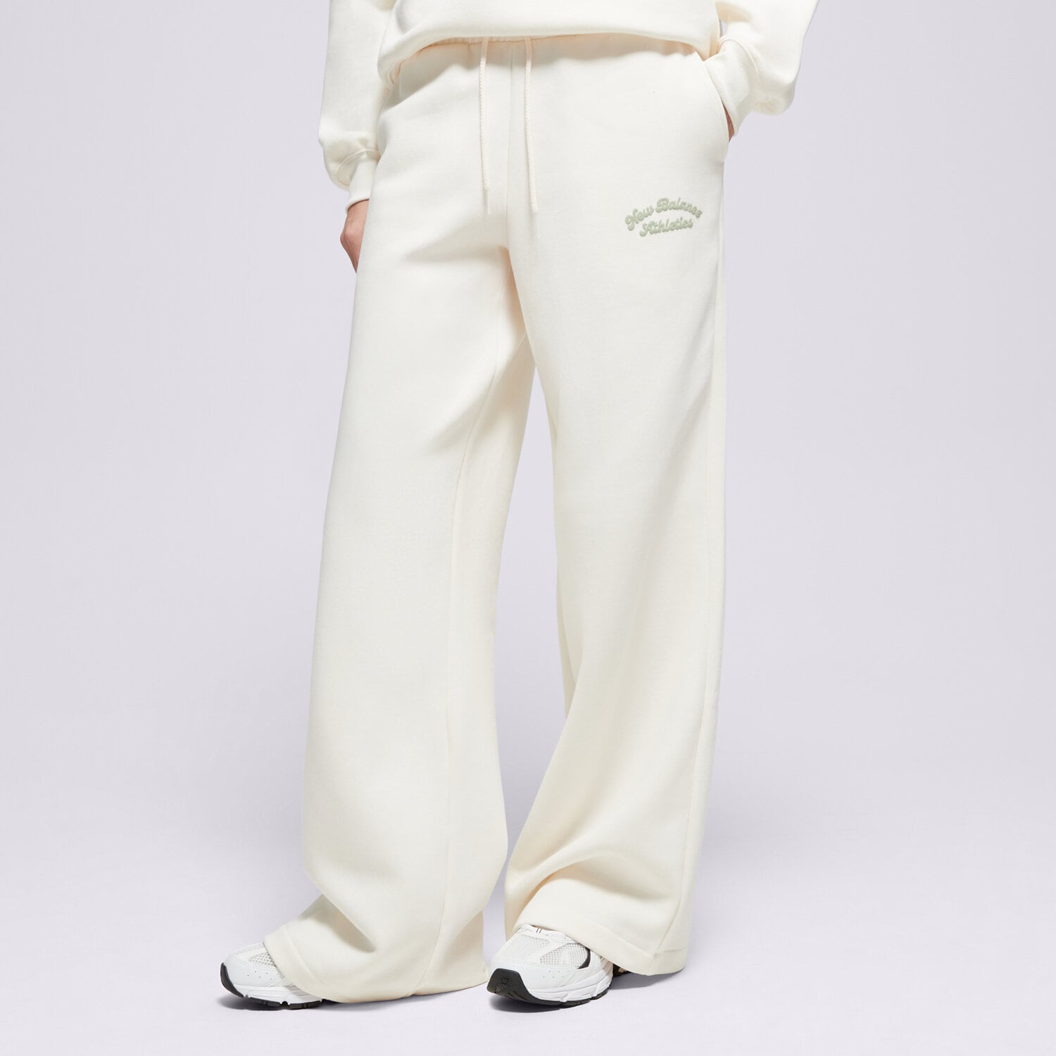Spodnie sportowe damskie NEW BALANCE SPODNIE LINEAR HERITAGE FLEECE WIDE LEG PANT WP53902PEF BEŻOWY