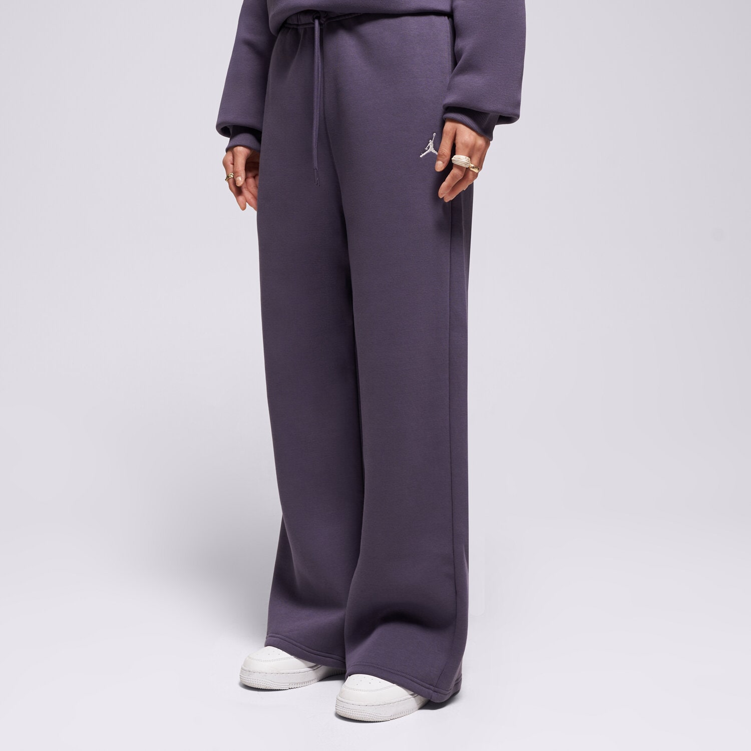 Spodnie sportowe damskie JORDAN SPODNIE W J BRK FLC OH PANT IH2394-573 FIOLETOWY