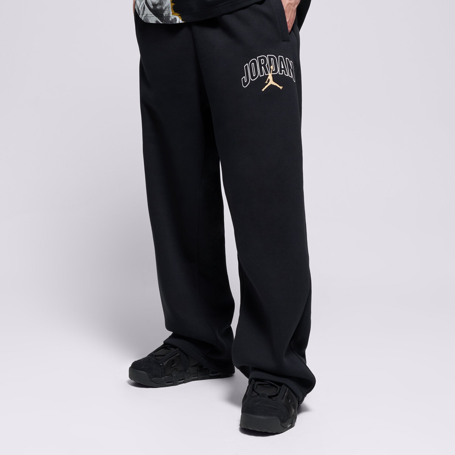 Spodnie sportowe męskie JORDAN SPODNIE M J BRK OVS GFX IB7243-011 CZARNY